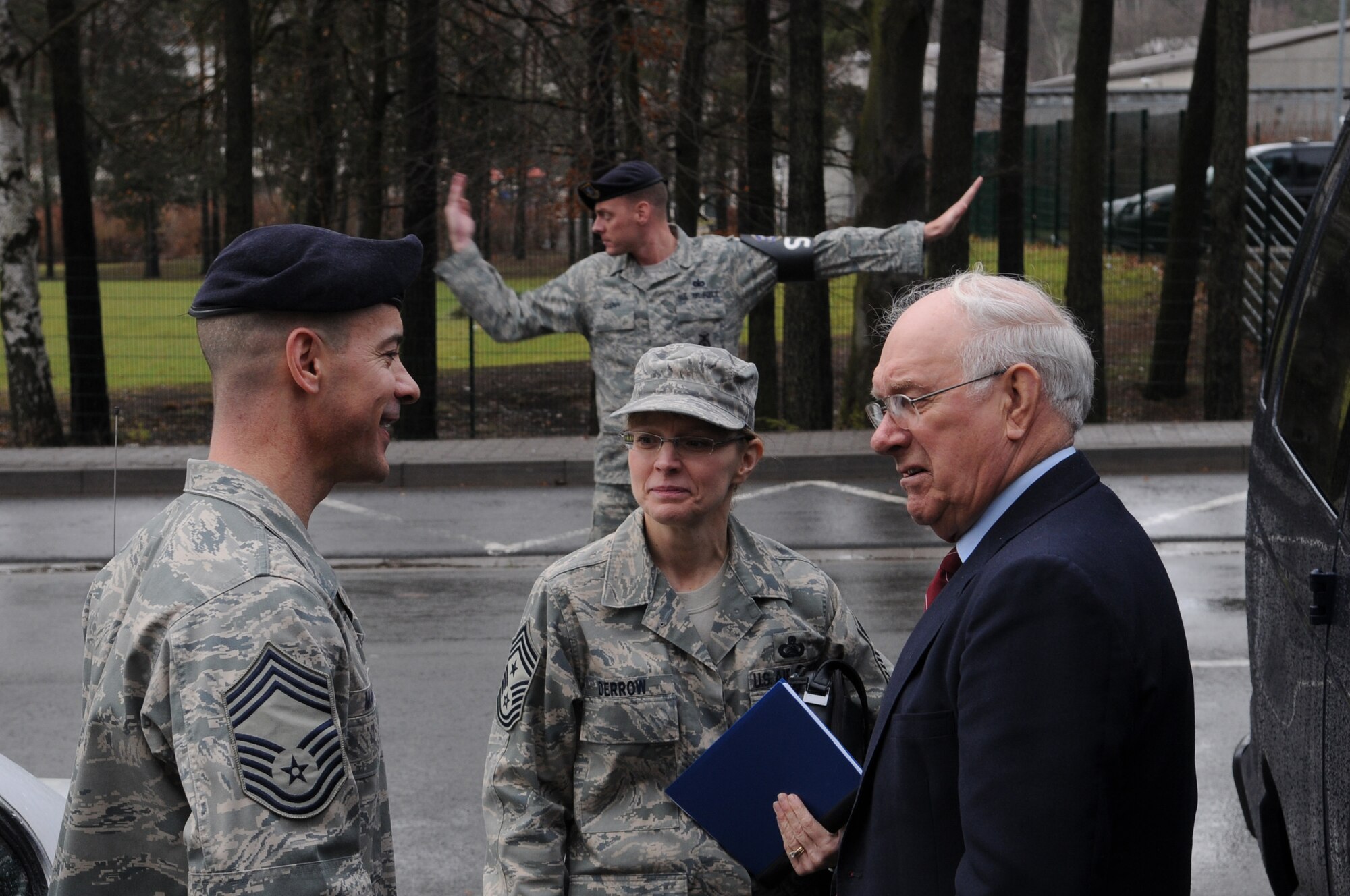 Chief Master Sgt. Mark. D Marson (left), 569th Security Forces Squadron, welcomes retired Chief Master Sgt. of the Air Force Sam E. Parish and Chief Master Sgt. Pamela A. Derrow, U.S. Air Forces in Europe command chief, to the 569th SFS during a visit to Kapaun Air Station, Germany, Jan. 23, 2009. (U.S. Air Force photo by Airman 1st Class Caleb Pierce) 