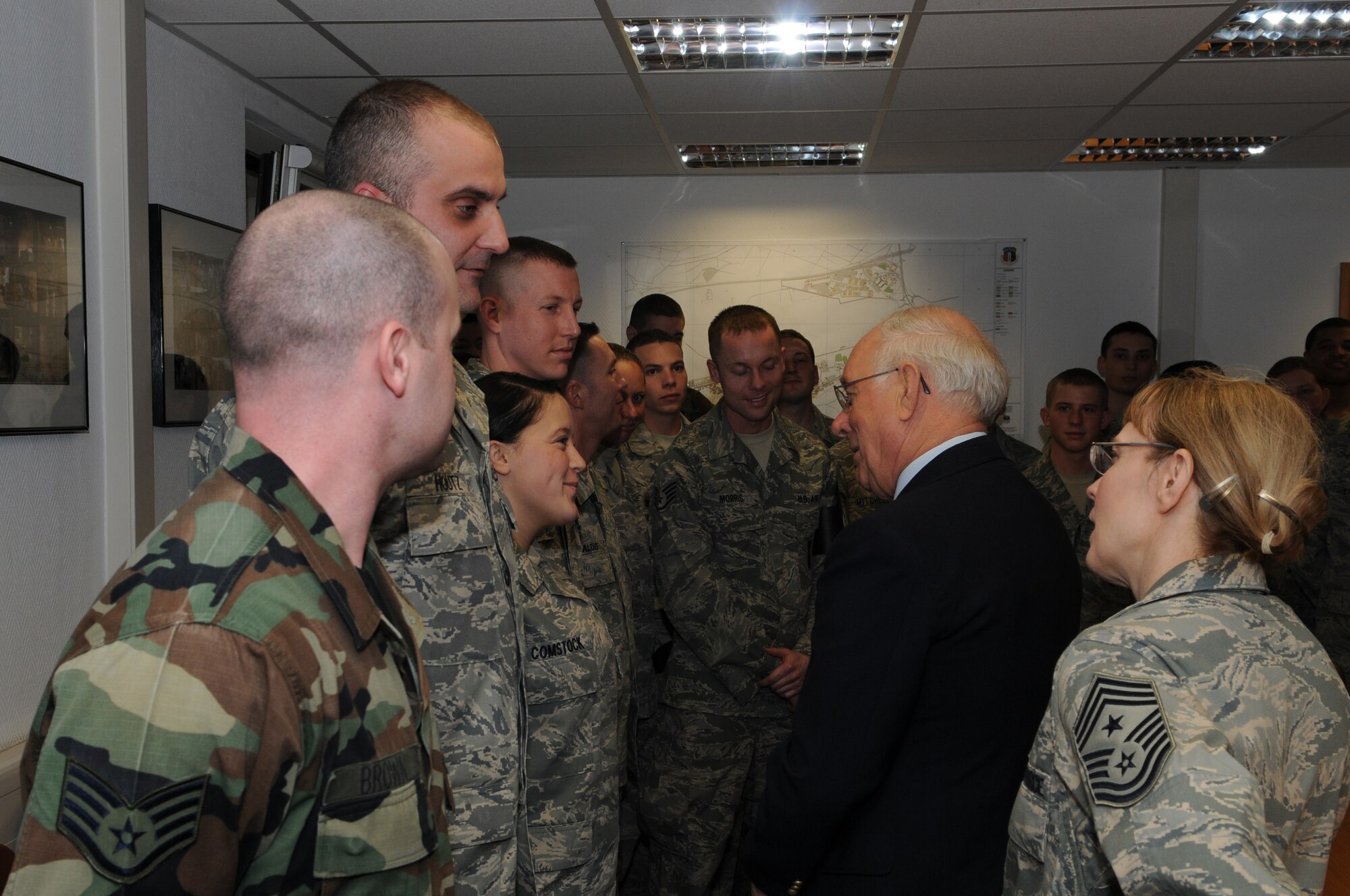 Retired Chief Master Sgt. of the Air Force Sam E. Parish and Chief Master Sgt. Pamela A. Derrow, U.S. Air Forces in Europe command chief, talk to 569th Security Forces Squadron members during a visit to Kapaun Air Station, Germany, Jan. 23 2009. (U.S. Air Force photo by Airman 1st Class Caleb Pierce) 