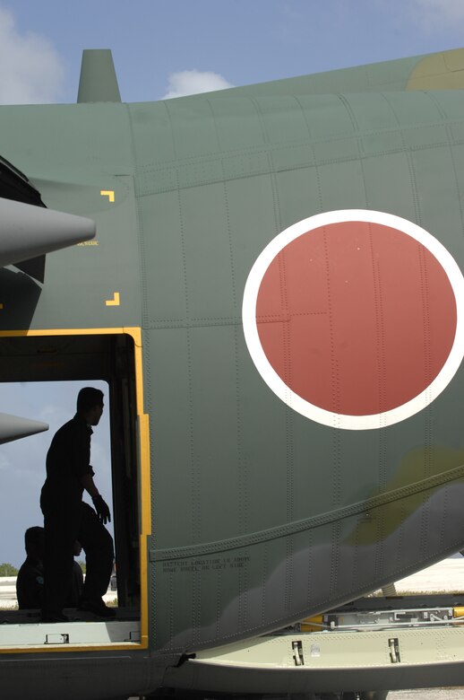 ANDERSEN AIR FORCE BASE, Guam - A member of the Japan Air Self Defense Force offloads equipment after arriving on Andersen AFB in a C-130 Hercules Jan 27.  More than 60 JASDF members arrived in three C-130s to participate in Exercise Cope North 09-1, a regularly scheduled exercise scheduled for Feb. 2-13.  Cope North is designed to enhance U.S. and Japanese air operations in defense of Japan.  (U.S. Air Force photo by Master Sgt. Kevin J. Gruenwald) 



