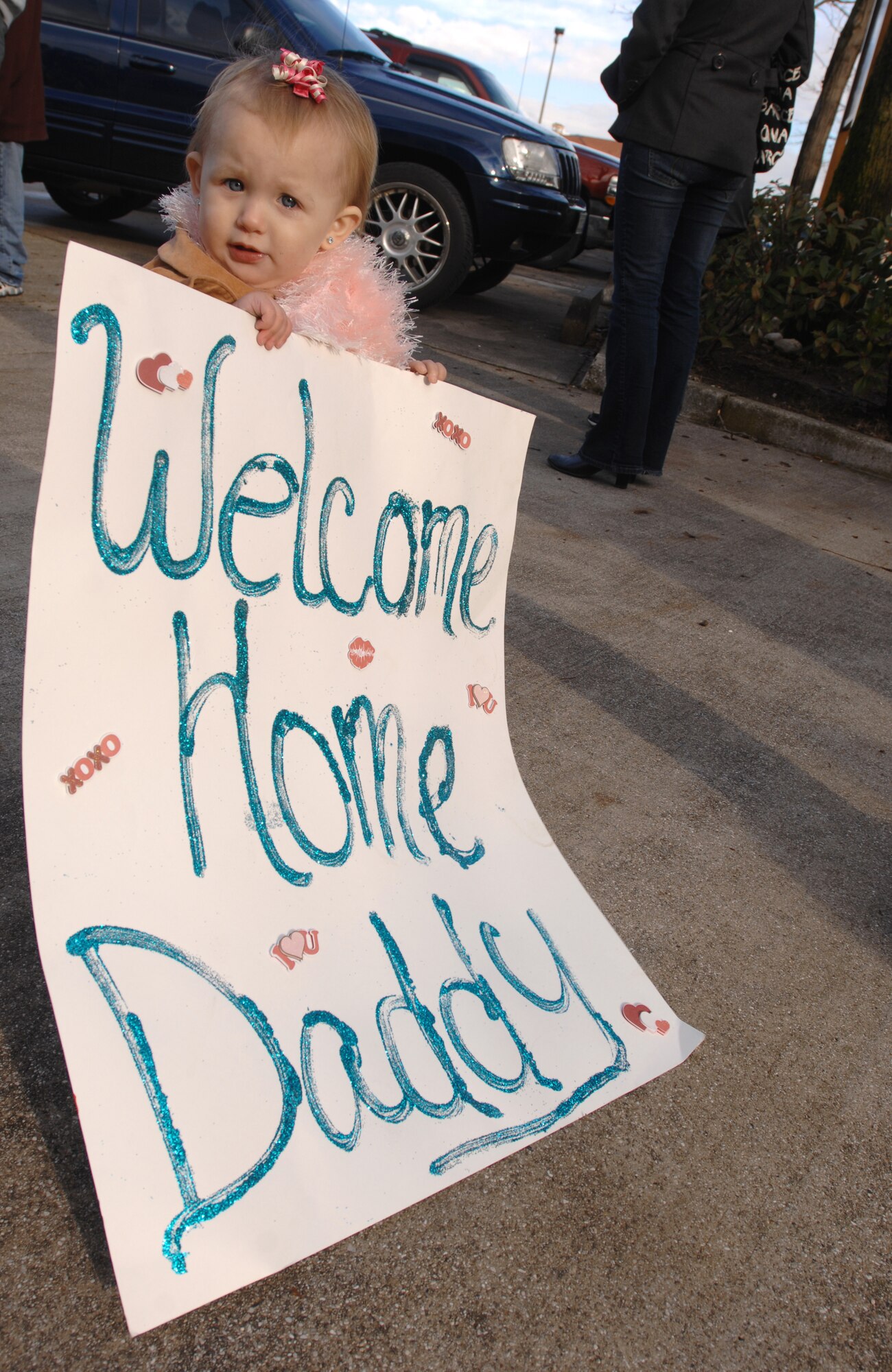 One-year-old Emma Stawicki waits patiently Jan. 24 for her dad, Senior Airman Craig Stawicki, 603rd Air Control Squadron, to return from his Air Expeditionary Force 5/6 deployment to Southwest Asia.  Airman Stawicki was deployed to the 71st EACS in support of Operation Iraqi and Enduring Freedom and Joint Task Force-Horn of Africa. (U.S. Air Force photo/ Staff Sgt. Patrick Dixon)