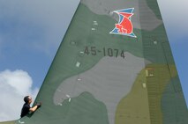ANDERSEN AIR FORCE BASE, Guam -- A member of the Japan Air Self Defense Force performs post flight maintenance on a JASDF C-130 Hercules after its arrival at Andersen AFB for participation in Exercise Cope North 09-1 Jan. 27.  More than 60 JASDF members arrived in three C-130s to participate in Exercise Cope North 09-1, a regularly scheduled exercise scheduled for Feb. 2-13.  Cope North is designed to enhance U.S. and Japanese air operations in defense of Japan. (U.S. Air Force photo by Master Sgt. Kevin J. Gruenwald)


