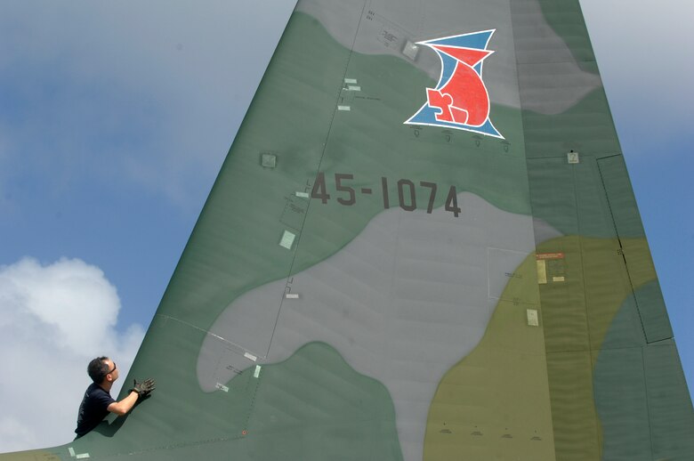 ANDERSEN AIR FORCE BASE, Guam -- A member of the Japan Air Self Defense Force performs post flight maintenance on a JASDF C-130 Hercules after its arrival at Andersen AFB for participation in Exercise Cope North 09-1 Jan. 27.  More than 60 JASDF members arrived in three C-130s to participate in Exercise Cope North 09-1, a regularly scheduled exercise scheduled for Feb. 2-13.  Cope North is designed to enhance U.S. and Japanese air operations in defense of Japan. (U.S. Air Force photo by Master Sgt. Kevin J. Gruenwald)



