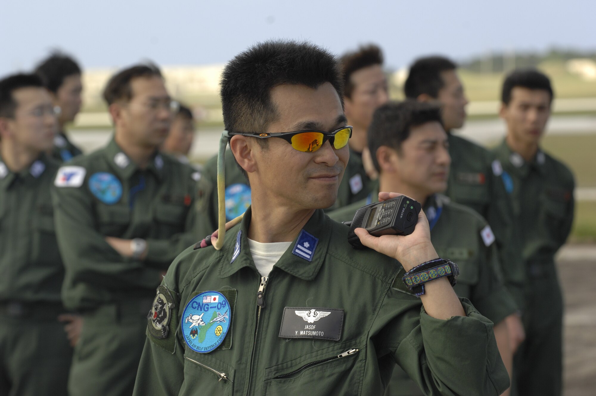 ANDERSEN AIR FORCE BASE, Guam -- Members of the Japan Air Self Defense Force wait outside of their C-130 Hercules after arriving here for participation in Exercise Cope North 09-1 Jan. 27.  More than 60 JASDF members arrived in three C-130s to participate in Exercise Cope North 09-1, a regularly scheduled exercise scheduled for Feb. 2-13.  Cope North is designed to enhance U.S. and Japanese air operations in defense of Japan. JASDF F-2s  from the 6th Squadron, Tsuiki Air Base, Japan, and E-2Cs from the 601st Squadron, Misawa Air Base, Japan, will join forward deployed USAF F-16 Fighting Falcons from the 18th Aggressor Squadron, Eielson AFB, Alaska, B-52 Stratofortress currently deployed to Andersen from the 23rd Expeditionary Bomb Squadron, and Navy EA-6B from VAQ-136 Carrier Air Wing Five, Atsugi, Japan, will participate in this year's exercise with a focus on interoperability.  
(U.S. Air Force photo by Master Sgt. Kevin J. Gruenwald) 


