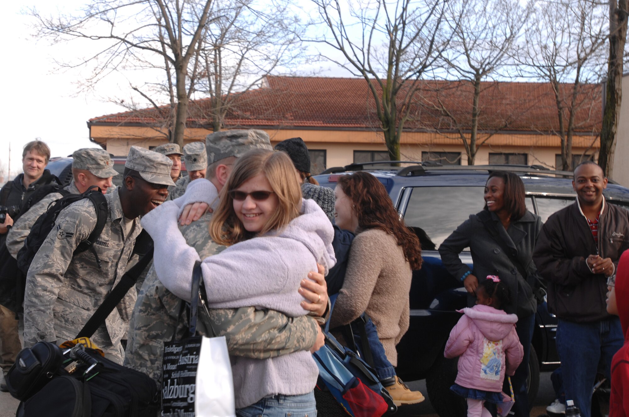 Airmen and family members 603rd Air Control Squadron welcome home more than 60 members of the unit who returned here Jan. 24 following their Air Expeditionary Force 5/6 deployment to Southwest Asia. The Airmen were deployed to the 71st EACS in support of Operation Iraqi and Enduring Freedom and Joint Task Force-Horn of Africa. (U.S. Air Force photo/ Staff Sgt. Patrick Dixon) (U.S. Air Force photo/ Staff Sgt. Patrick Dixon)