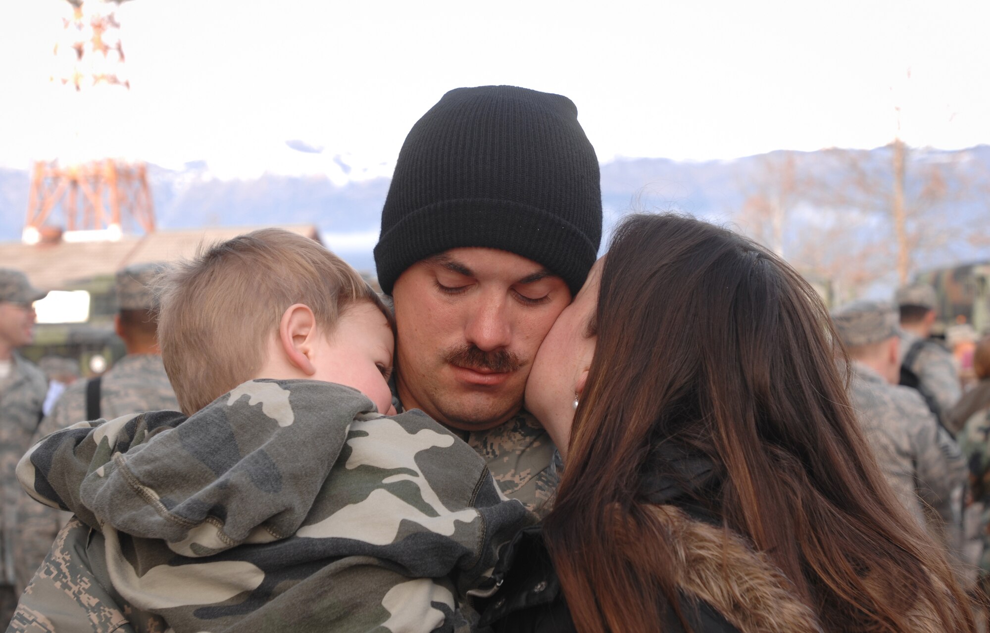 Staff Sgt. David Frazier from the 603rd Air Control Squadron reunites with his family Jan. 24 following his Air Expeditionary Force 5/6 deployment to Southwest Asia. Sergeant Frazier was deployed to the 71st EACS in support of Operation Iraqi and Enduring Freedom and Joint Task Force-Horn of Africa. (U.S. Air Force photo/ Staff Sgt. Patrick Dixon)