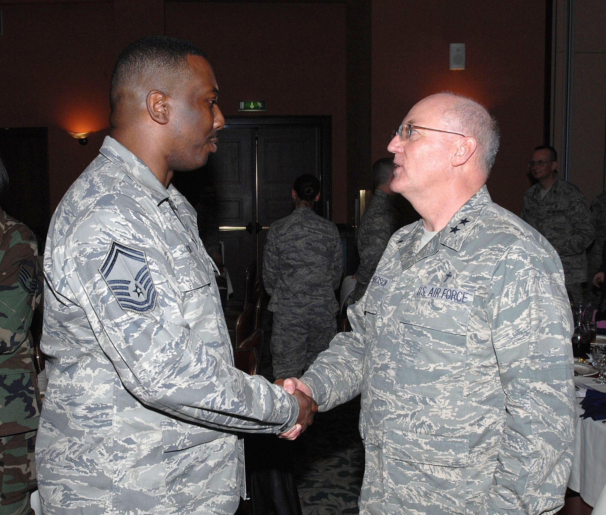 Senior Master Sgt. Frank Tuck of the 31st Fighter Wing inspector general office speaks with Chaplain (Maj. Gen.) Cecil Richardson, Air Force Chief of Chaplains, after the base's National Prayer Luncheon Jan. 22 at the La Bella Vista Club. Chaplain Richardson was the guest speaker at the luncheon. (U.S. Air Force photo/Tech. Sgt. Patrick Hyde)