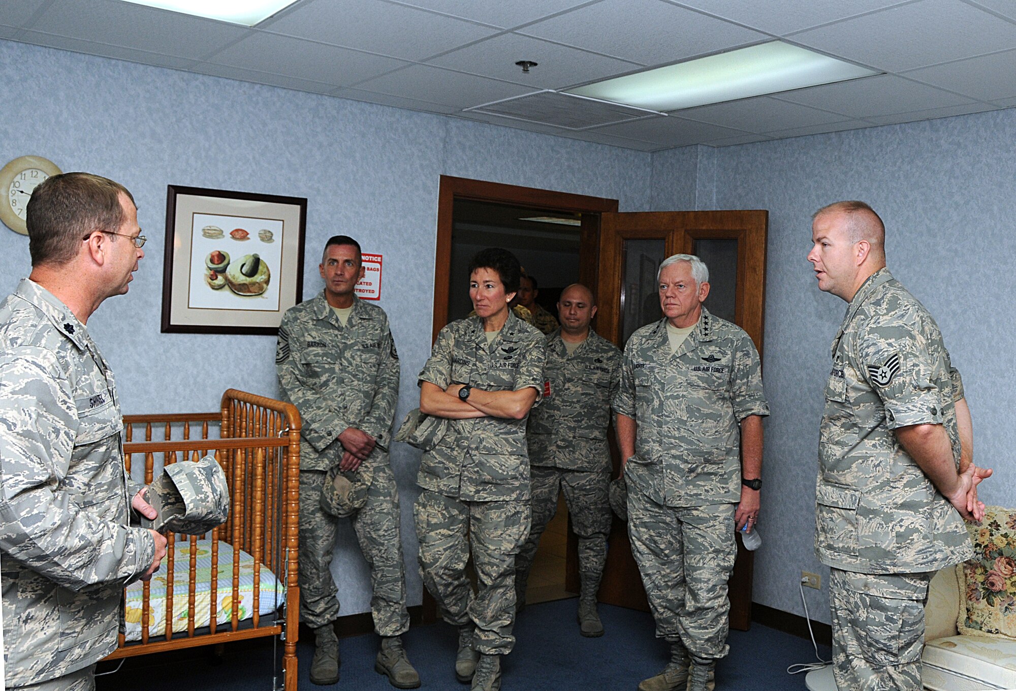 ANDERSEN AIR FORCE BASE, Guam -- Lt. Col. Steven Shinkel, 734th Air Mobility Squadron commander, explains the importance of the "baby room" in Team Andersen's passenger terminal to Gen. Arthur Lichte, Air Mobility Command commander, and his entourage here Jan. 28. The "baby room" is used to give nursing mothers privacy or infants and toddlers some much needed rest while at the passenger terminal. The "baby room" has received several good comments from parents of infants or toddlers since it has been operational. (U.S. Air Force photo by Airman 1st Class Carissa Wolff)