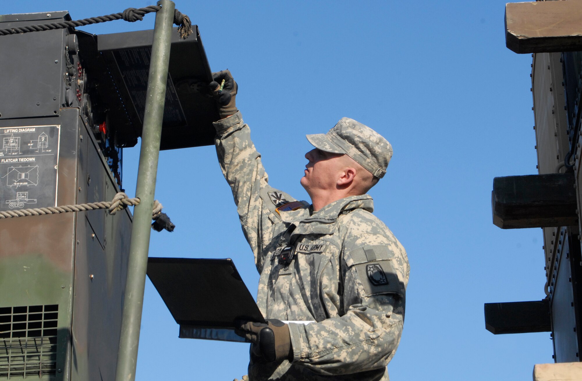U.S. Army Sgt. 1st Class Eric Burgman, Alpha 4th Battalion - 5th Air Defense Artillery Regiment Launcher platoon sergeant and team evaluator member, inspects a Patriot launching station during an Army Table 8 evaluation at Kunsan Air Base, Republic of Korea Jan. 28. The Army air defense Soldiers and their Patriot missile batteries are key members of the Wolf Pack, vital to the mission of defending the base. (U.S. Air Force photo by: Senior Airman Dana Hill)