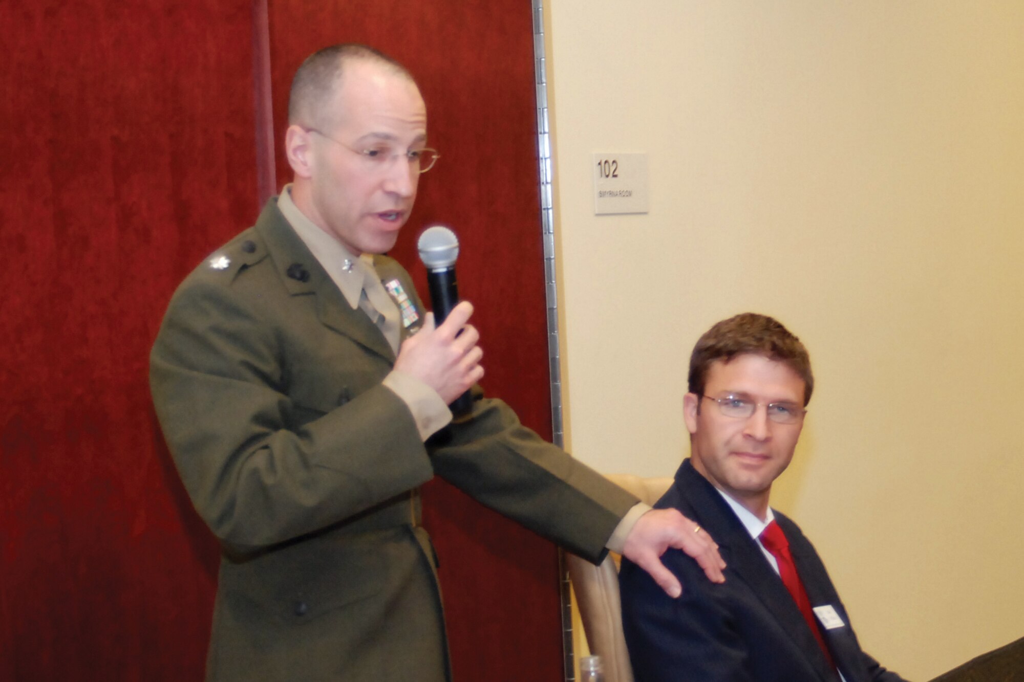 Lt. Col Roni Meyerhoff, 4th Marine Logistics Group inspector/instructor, introduces his honorary commander associate, Mr. Matt Wilkins, an attorney at law with King & Yaklin.   (U.S. Air Force photo/Master Sgt. Stan Coleman)
