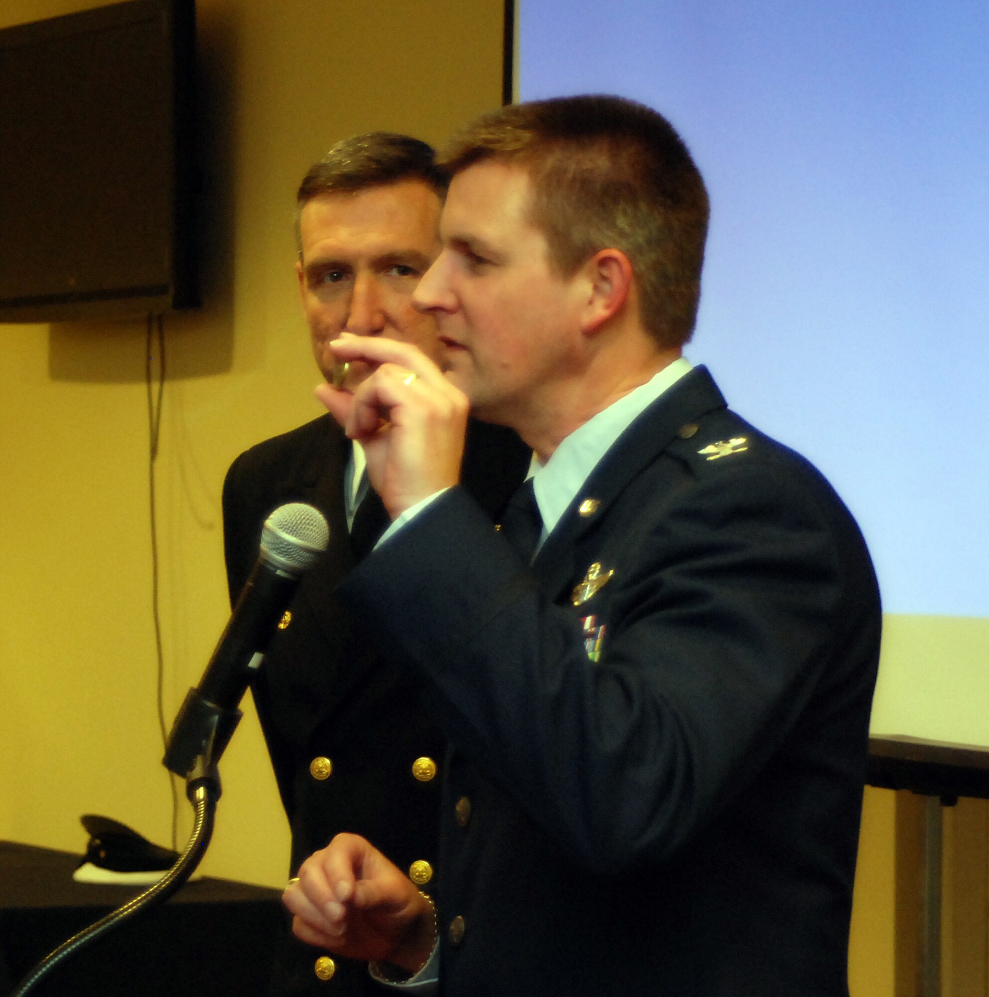 Col. Heath Nuckolls, 94th Airlift Wing commander, explains the significance of the unit coin tradition and the coin challenge to new inductees of the Honorary Commander's Association at Dobbins Air Reserve Base.   Each year, approximately 25 civilians are paired with commanders and senior officers of military units stationed at Dobbins and Naval Air Station Atlanta.
The Honorary Commanders Association is a cooperative effort of the Cobb Chamber of Commerce, Dobbins Air Reserve Base and Naval Air Station Atlanta.  The purpose is to educate the local business community in the Guard’s and Reserve’s role in the total force structure for national defense.  The HCA also encourages employers to support employees who are members of the Guard and Reserve as well as foster better understanding and community support of the Army, Navy, Air Force, Marine Corps, Air National Guard and Army National Guard.   (U.S. Air Force photo/Master Sgt Stan Coleman)
