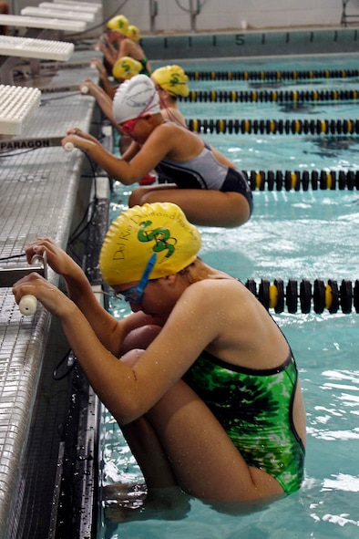 LAUGHLIN AIR FORCE BASE, Texas – Members of the Del Rio Diamondbacks, and one opponent prepares to start a race during a swim meet in Georgetown recently. Swimmers of all levels, from first-time competitors to future Olympic hopefuls, competed at the Southwestern University natatorium. While swimming for their team, swimmers focused on improving their personal records in a wide variety of individual and relay events. (Contributed photo)