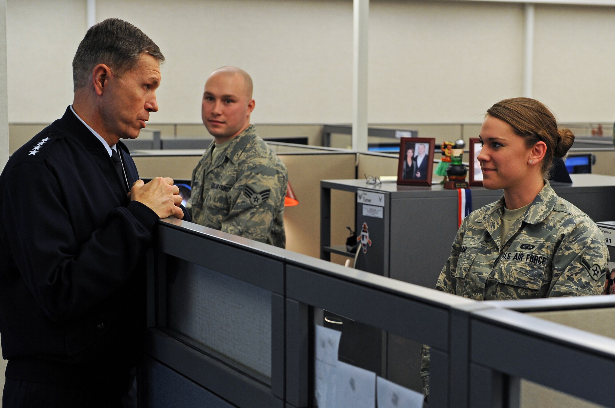 (Left) Gen. William M. Fraser III, U.S. Air Force Vice Chief of Staff, talks with Airman Constance Noah, Air Force Financial Services Center military pay technician, during a base tour, Jan 23. The AFFSC centrally processes all military pay, travel pay and transactions for the Air Force. (U.S. Air Force photo/Senior Airman Marc I. Lane)