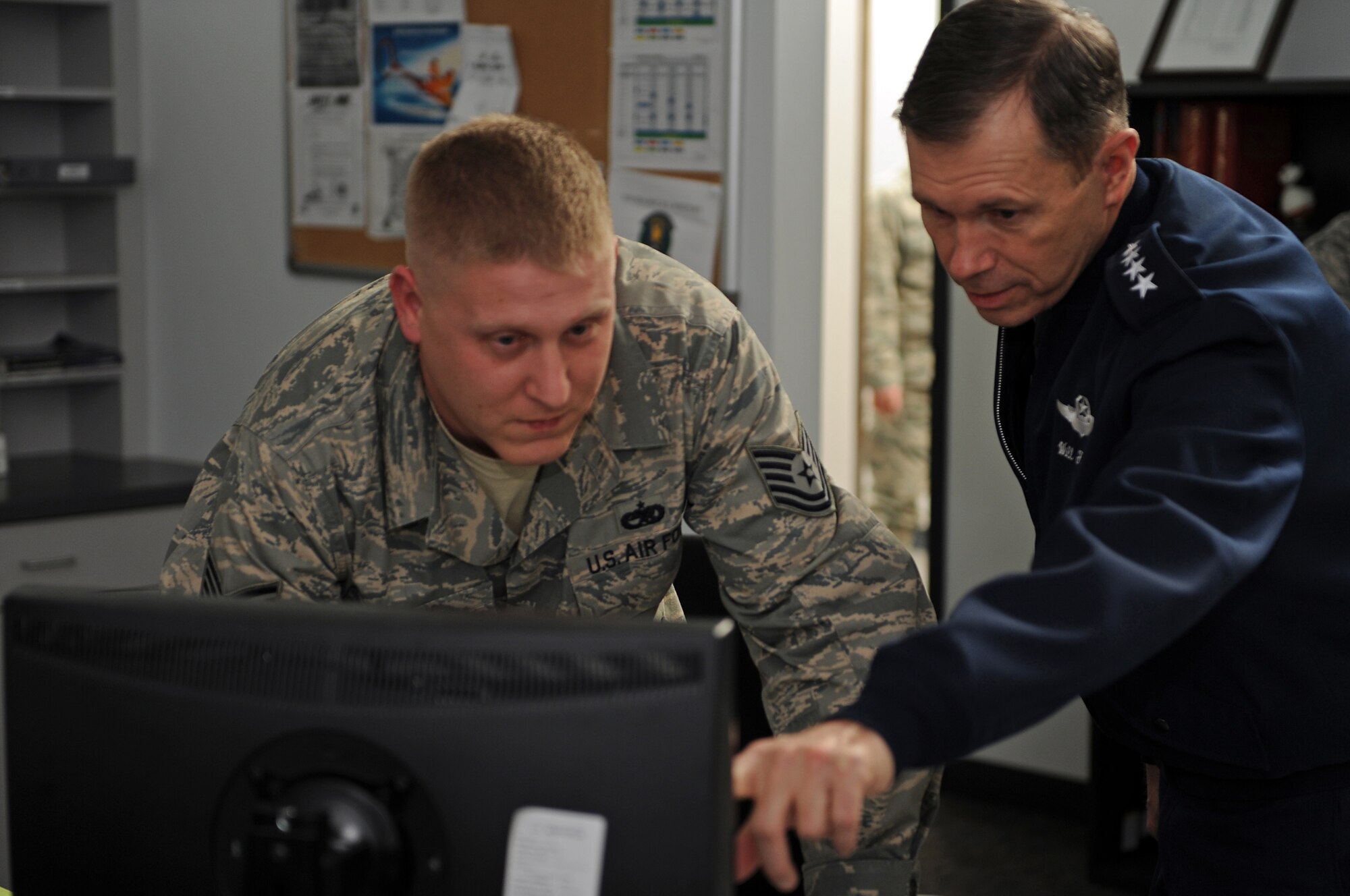 (Left) Tech. Sgt Christopher Hudak, 28th Maintenance Operations Squadron senior weapons systems controller, describes a flightline display to Gen. William M. Fraser III, U.S. Air Force Vice Chief of Staff, during a base tour, Jan 23. General Fraser was the 28th Bomb Wing commander from February 1997 to May 1998. (U.S. Air Force photo/Senior Airman Marc I. Lane)