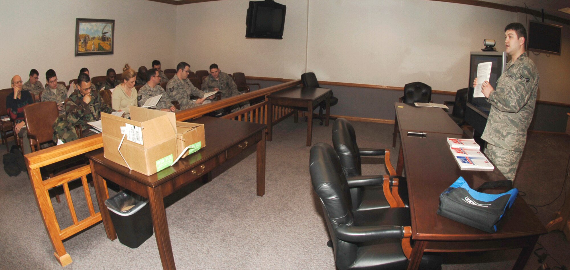 MCCONNELL AIR FORCE BASE, Kan. -- Senior Airman Mitchell Jones, 22nd Air Refueling Wing legal office, instructs the Volunteer Income Tax Assistant class on rules and guidelines for the 2008 tax season at the legal office, Jan. 14. The tax center recruited more than 50 volunteers across the base to help active duty, Guardsmen, Reservists, retirees and family members with free tax preparations. (Photo by Airman 1st Class Maria Ruiz)
