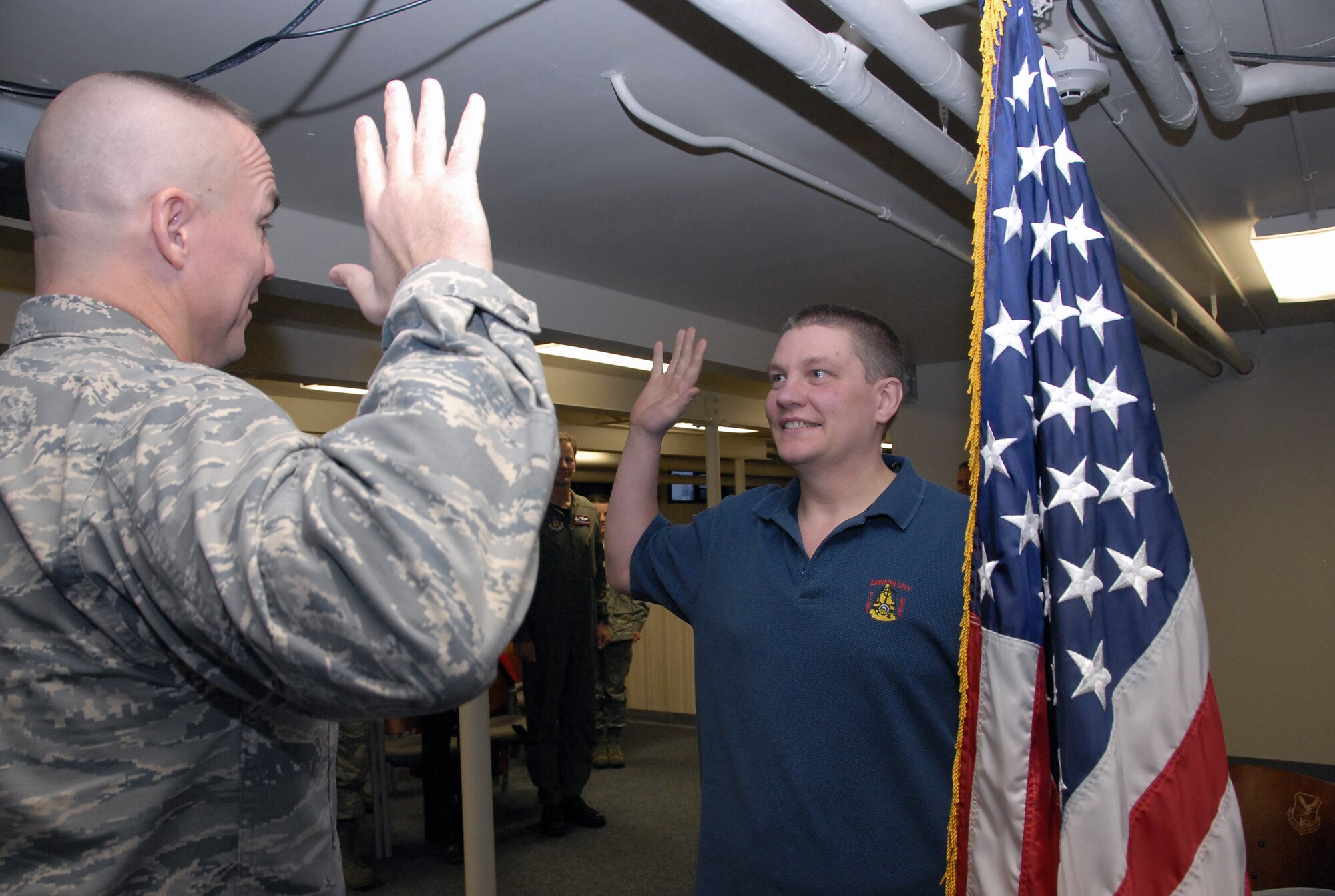Derrick Bell enlists in the Air Force Reserve Jan. 15 at Elmendorf Air Force Base, Alaska. Airman Bell is the newest enlisted member of the 477th Fighter Group, a Reserve unit responsible for recruiting, training, developing and retaining Citizen Airmen. In only 11 months, Airman Bell lost 115 pounds to meet physical standards for the Air Force Reserve. Today he is preparing to attend technical training to work as an F-22 Raptor crew chief. (U.S. Air Force photo/Staff Sgt. Rhiannon Willard)
