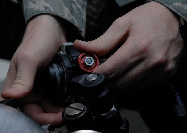 Staff Sgt. Bryan Worley closes the bypass valve on a self-contained breathing apparatus while taking inventory Jan. 26 on Charleston AFB. Explosive ordnance disposal Airmen safely examine and dispose of explosive devices. Sergeant Worley is an EOD technician with the 437th Civil Engineer Squadron. (U.S. Air Force photo/Senior Airman Katie Gieratz) 