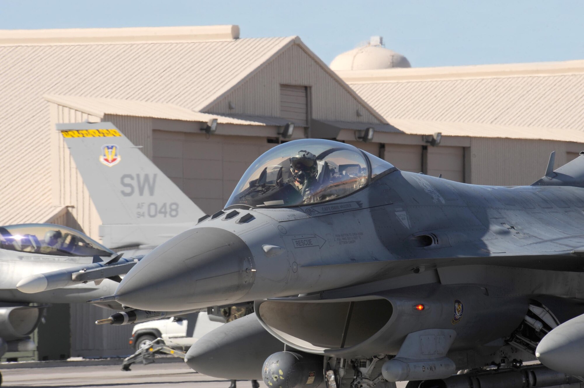 NELLIS AIR FORCE BASE, Nev. -- An F-16CJ fighter pilot from the 79th Fighter Squadron, Shaw AFB, S.C., taxis out for a training mission during Red Flag 09-2 at Nellis AFB, Nev., Jan. 27. Red Flag is a multi-national exercise providing a realistic environment to practice combat scenarios. The experience gained during the exercise is vital to the survival of pilots in combat. (U.S. Air Force photo/Senior Airman Larry E. Reid Jr.)