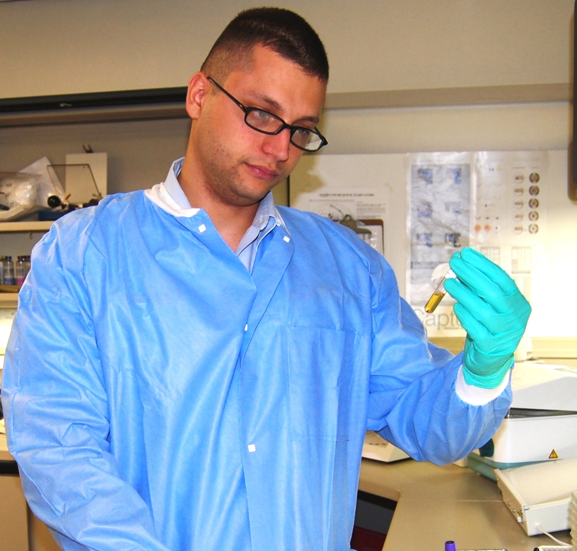 Airman De Castro Pretelt screens a patient’s plasma in the Keesler Medical Center blood bank.  May 26, he’ll be commissioned a captain and July 1 he begins the internal medicine residency program. (U.S. Air Force photo by Steve Pivnick)