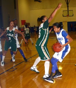 Randolph High guard Elena Gumbs, right, tries to get around some tough defense from Cole High during the Ro-Hawks 49-46 loss last week. Gumbs led all Ro-Hawk scorers with 19 points. (Photo by Sylvia Kuwamura)