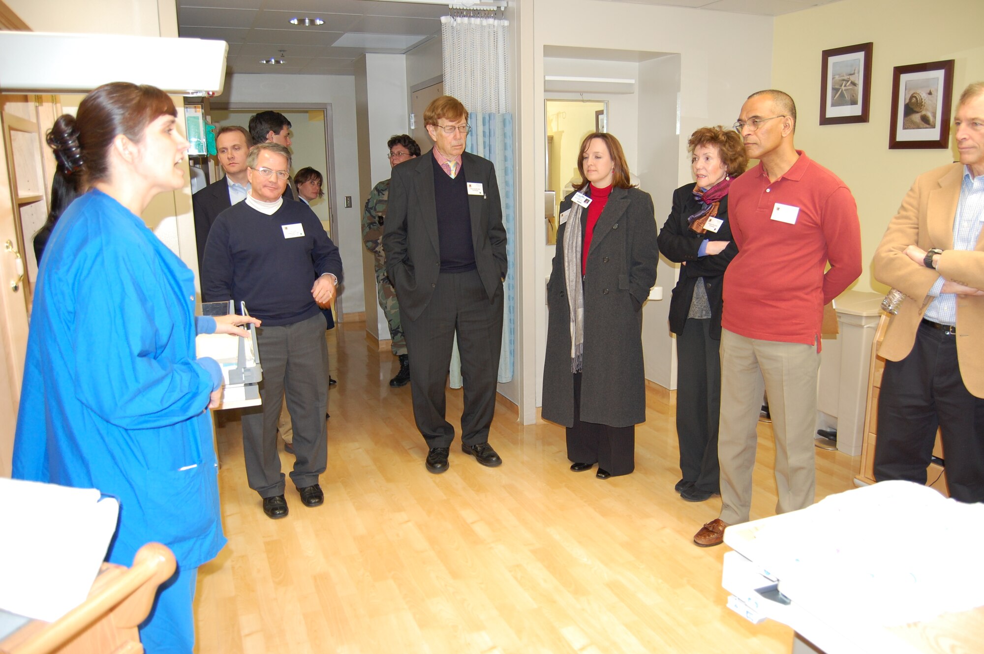 Second Lt. Candy Davis, 81st Inpatient Operations Squadron, shows one of the family birthing center rooms to guests at the recent “Evening of Medical Collaboration” jointly hosted by Humana Military Healthcare Services and Keesler Medical Center.   About 175 members of the community, including legislative staff, sister service representatives, hospital executives and private practice physicians, spent more than three hours at the medical center.  Following a social hour, Brig. Gen. (Dr.) Daniel Wyman, 81st Medical Group commander, provided a presentation, “Premiere Healthcare through Community Collaboration.”   Participants toured the medical center’s state-of-the-art capabilities such as magnetic resonance imaging, refractive surgery center, genetics center, simulation laboratory and family birthing center.  General Wyman said the program “left a huge, very positive impression on the community and will pay dividends well into the future.”  (U.S. Air Force photo by Steve Pivnick)