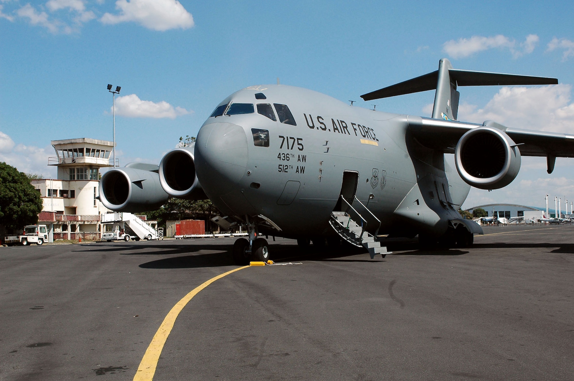 A C-17 Globemaster III from Dover Air Force Base, Del., sits on the Managua International Airport Jan. 18 in Nicarauga. Airmen of the Air Force Reserve's 326th Airlift Squadron delivered approximately 18,000 pounds of humanitarian cargo consisting of desks, chairs, file cabinets and books for use at a Nicaraugan university library. (U.S. Air Force photo/Capt. Marnee A.C. Losurdo) 
