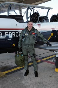 Lt. Col. Rich Lowe, 39th Flying Training Squadron, poses after exiting a T-6A Texan II after a flight Jan. 28. Colonel Lowe pulled several people from the wreckage of Continental Airlines Flight 1404 that crashed on take-off at Denver International Airport on Dec. 20, 2008. (U.S. Air Force photo by Rich McFadden)