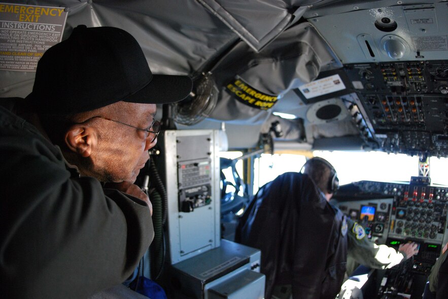 ANDREWS AIR FORCE BASE, Md.-- Charlton Jamieson, Montgomery County Public School mechanical service technician, inquisitively looks on as pilots from the 756th Air Refueling Squadron navigate to an air space just off the coast of Norfolk, Va. (U.S. Air Force Photo/ Senior Airman Ashley Crawford)
