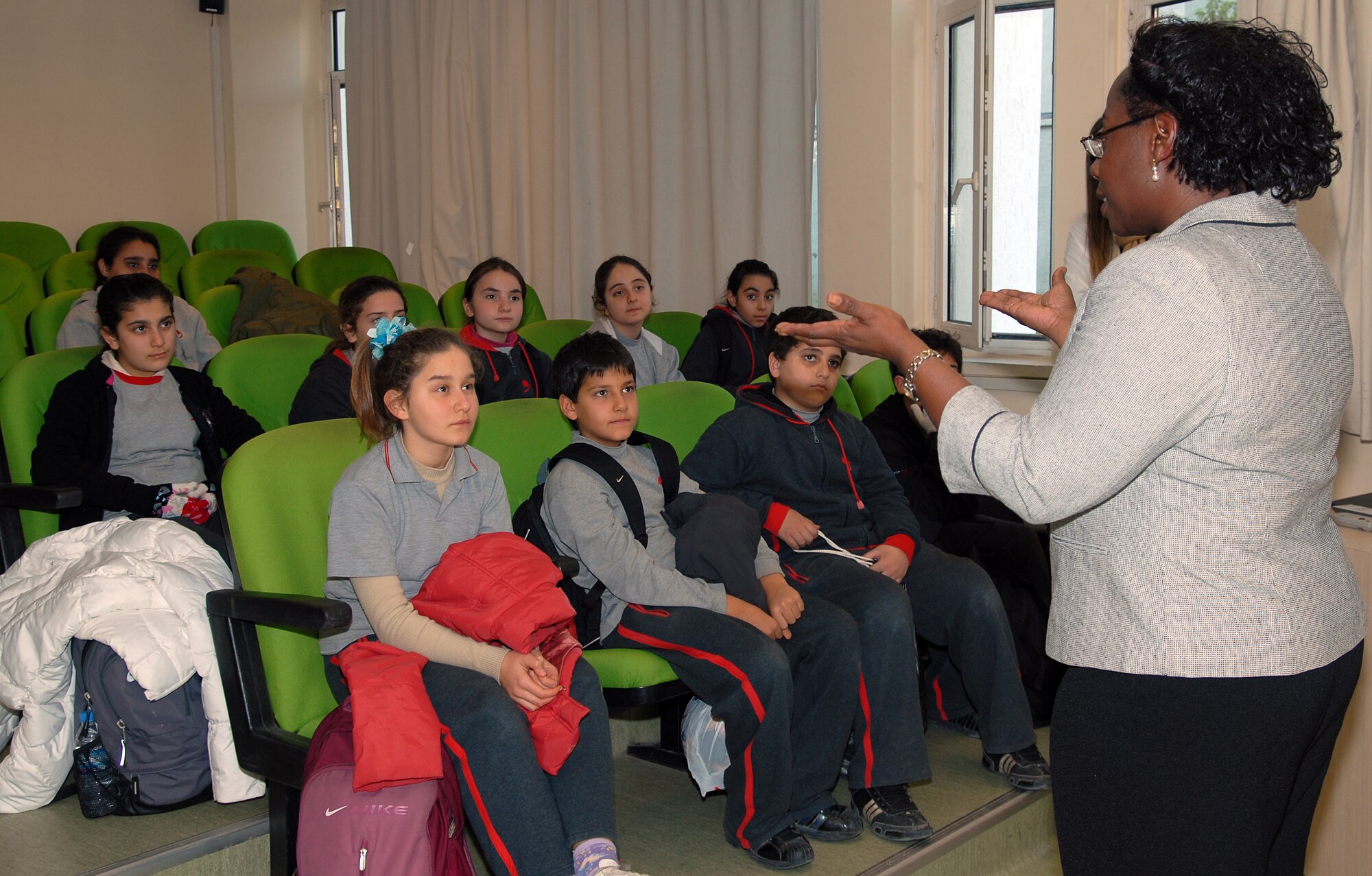 Lt. Col. Michelle Raven, 39th Air Base Wing staff judge advocate, speaks to a group of students from the Gundogdu Liesesi schoool in Adana, Turkey. Colonel Raven's talk focused on the history, signifigance and impact of Martin Luther King Jr. The talk was conducted to strengthen bods between the 39 ABW and local community. (Photo by Sukru Volkan)