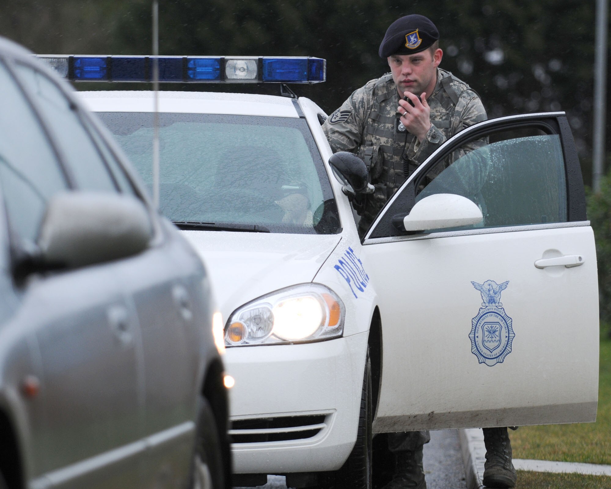 Staff Sgt. James Haddix from the 100th Security Forces Squadron, demonstrates how to properly execute a high-risk traffic stop during a training exercise Jan. 22, 2009, at RAF Mildenhall, England. Security forces members are highly trained Airmen, able to react quickly during emergency situations. They also enforce laws while providing security to members and the installation. (U.S. Air Force photo by Staff Sgt. Jerry Fleshman)