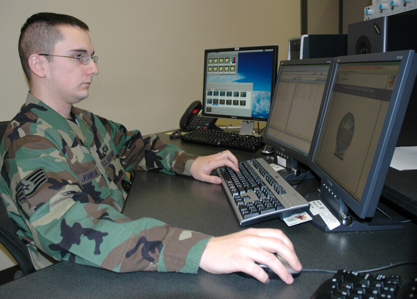 OFFUTT AIR FORCE BASE, Neb. -- Staff Sgt. Kevin Johnson, a broadcast weather technician with the American Forces Network Weather Center here, builds graphical animation for an upcoming AFNWC broadcast. (Photo by Ryan Hansen)