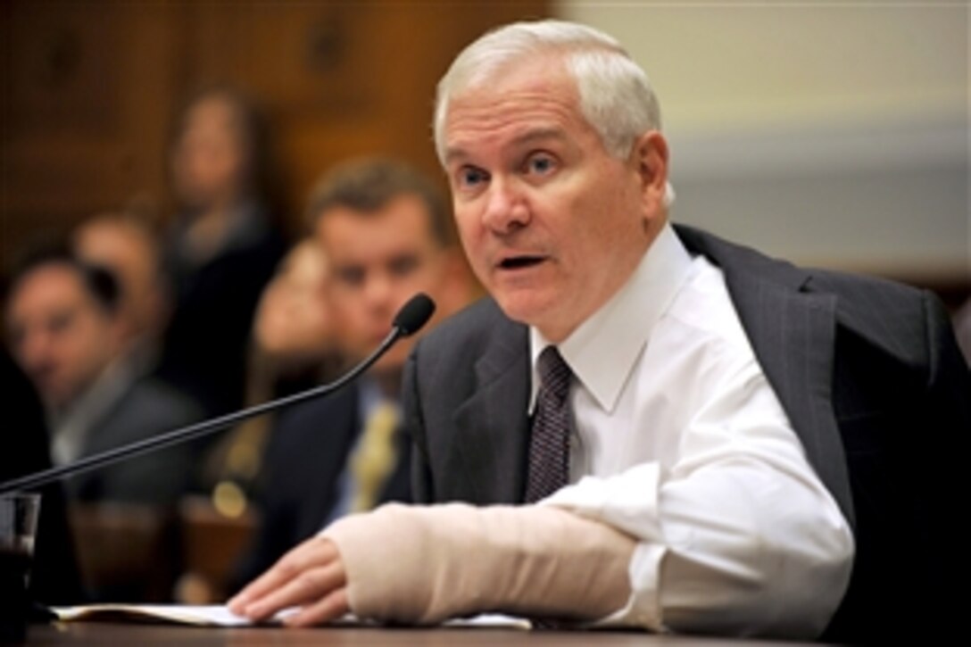 With his arm in a cast from a surgery last week, Defense Secretary Robert M. Gates testifies before the House Armed Services Committee in Washington, D.C., Jan. 27, 2009.  