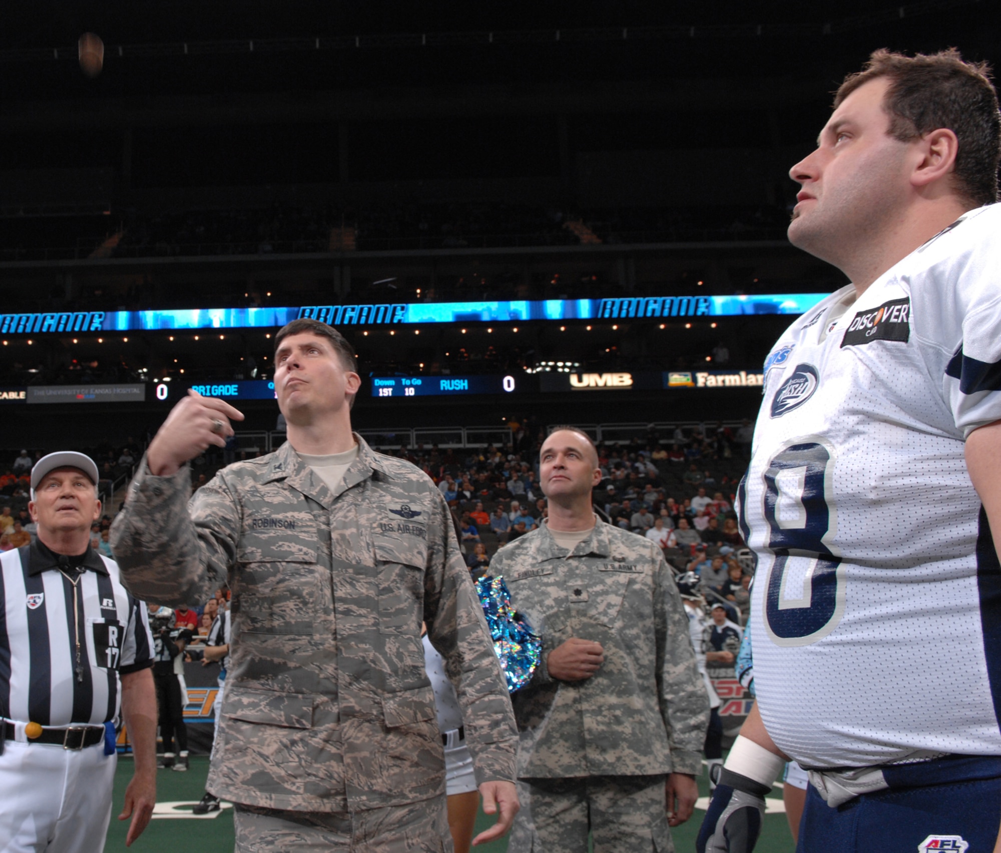KANSAS CITY, Mo. – Col. John Robinson, 509th Bomb Wing vice commander, performs a coin toss before the Kansas City Brigade versus the Chicago Rush game at the Sprint Arena April 14. The Kansas City Brigade (0-6) lost 49-42 to the Chicago Rush (5-2). The Kansas City Brigade is a team from the Arena Football League. The team got their name Nov. 21, 2005, when the AFL announced the team would be called the Kansas City Brigade.  The team then decided to model their team logo after the B-2. (U.S. Air Force photo/Airman 1st Class Stephen Linch)