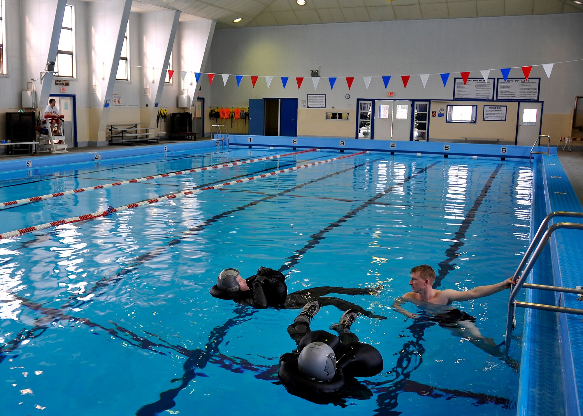 MISAWA AIR BASE, Japan -- Staff Sgt. Benjamin Thomas, 35th Operations Support Squadron Survival, Evasion, Resistance and Escape instructor, trains on water survival skills in the event of a crash over water Jan. 21, 2009. SERE provides personnel, Department of Defense civilians and contractors with training in evading capture, survival skills and the military code of conduct.  (U.S. Air Force photo by Senior Airman Chad Strohmeyer)