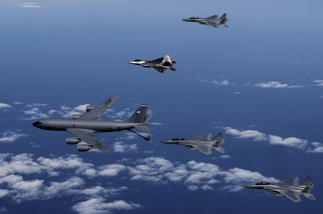 F-15 Eagles and an F-22 Raptor from the 325th Fighter Wing at Tyndall Air Force Base, Fla., participate in an aerial refueling mission with a KC-135 Stratotanker from the 117th Air Refueling Wing at Birmingham, Ala. (U.S. Air Force photo/Master Sgt. Scott Reed)