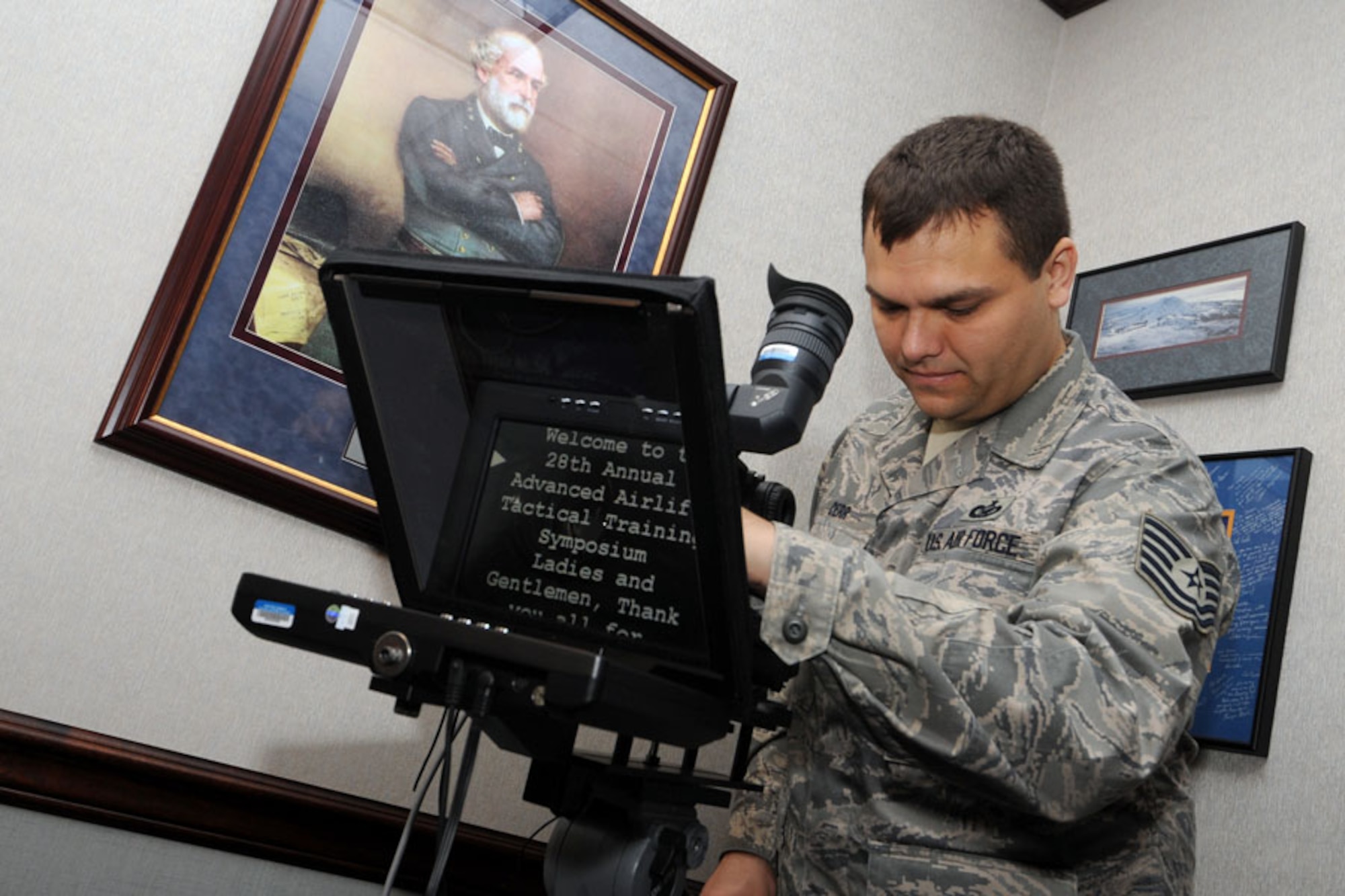 SCOTT AIR FORCE BASE, Ill. - Tech. Sgt. Joseph Derr, 375th Airlift Wing Public Affairs Video and Production NCOIC, prepares for an interview by checking settings on his camera and teleprompter. Sergeant Derr recently donated bone marrow to save a life through the DoD Bone Marrow Registry. (U.S. Air Force photo/Senior Airman Jonathan Lovelady)