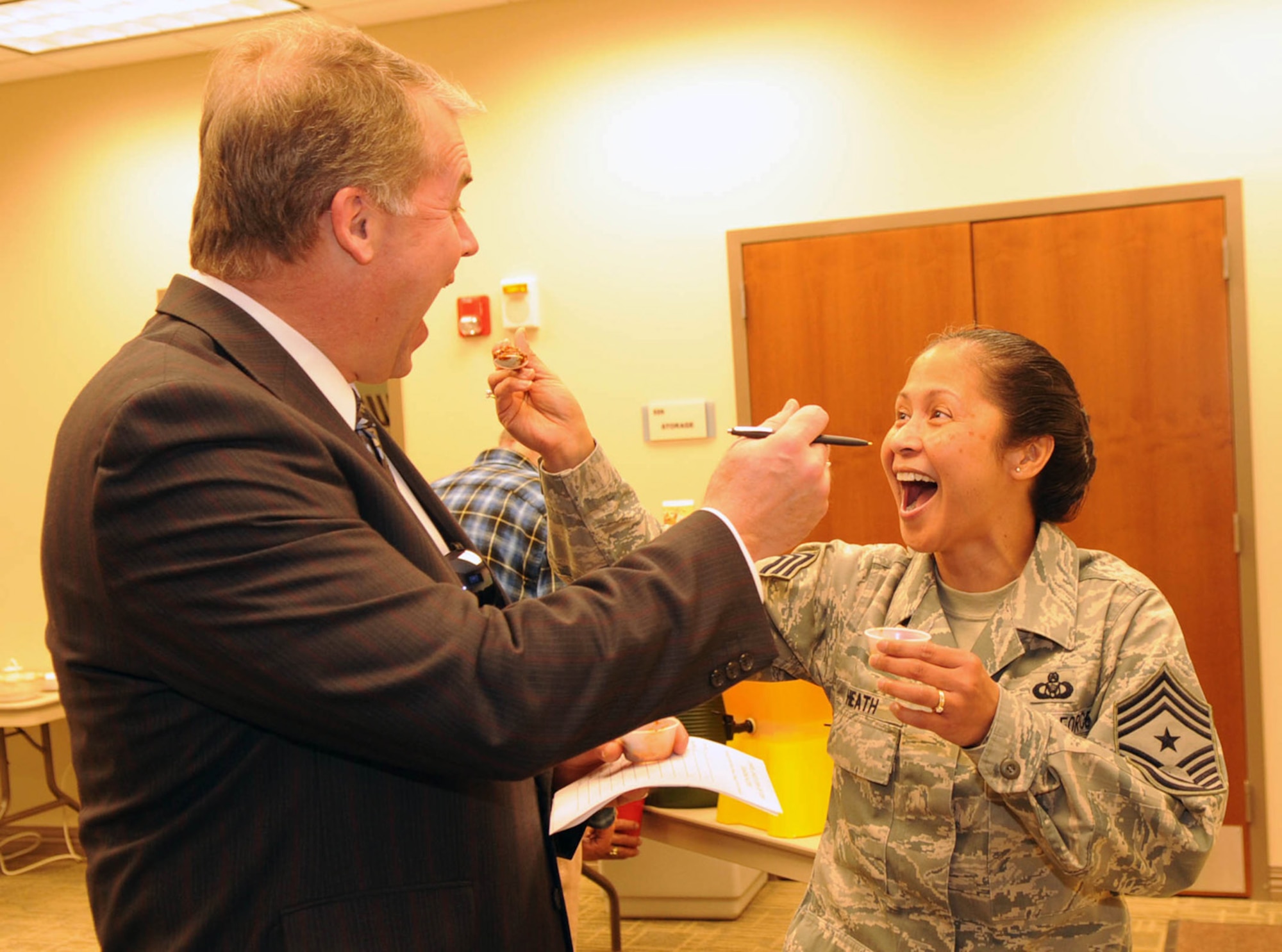 BUCKLEY AIR FORCE BASE, Colo. -- Chili Cook-Off judges, Doug Carroll, 460th Space Wing Director of Staff and Chief Master Sgt. Arleen Heath, 460th SW Command Chief, try the different chilis at the Sixth Annual Chapel Chili Cook-Off on Jan. 21. (U.S. Air Force photo by Senior Airman Christopher Bush)
