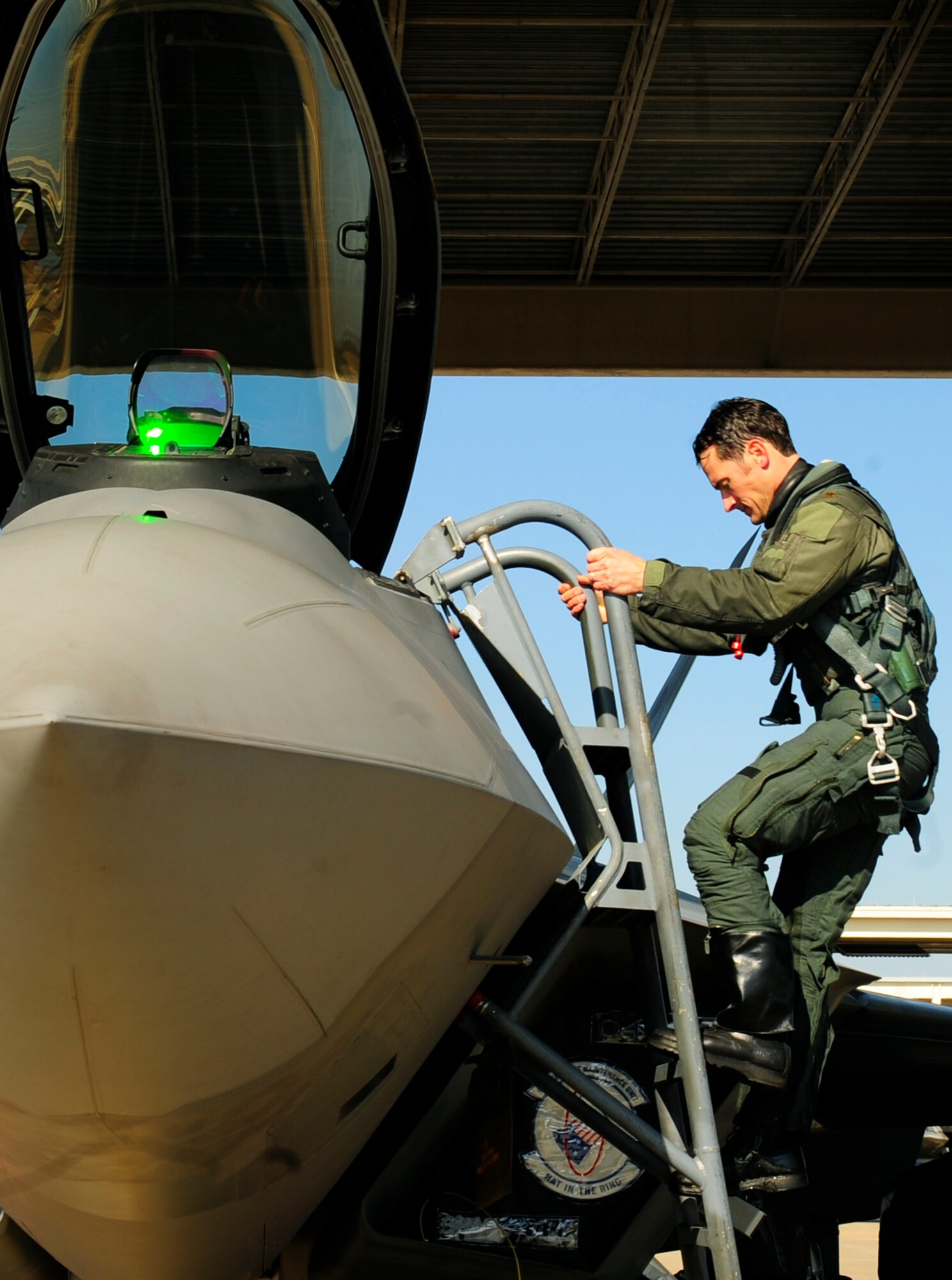 LANGLEY AIR FORCE BASE, Va. -- Maj. Paul "Max" Moga, F-22A Raptor Demonstration Team pilot, exits an F-22A Raptor after flying his final flight as the official demo team pilot Jan. 29. Hampton Roads Air Force Week begins April 18, and the 2009 F-22A Demonstration Team pilot is Maj. Dave "Zeke" Skalicky, who will perform here for AirPower over Hampton Roads April 24 to 26. (U.S. Air Force photo/Senior Airman Vernon Young)