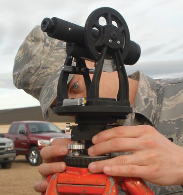 Staff Sgt. Benjamin Koren, 728th Air Control Squadron radar maintenance journeyman from Eglin Air Force Base, Fla., makes adjustments to level the transit at the 607th ACS TPS-75 radar training site Jan. 22. The transit is a device used to see where the TPS-75 radar will start and stop transmitting — also known as “blanking.”  (U.S. Air Force photo/Airman 1st Class Ronifel Yasay)
