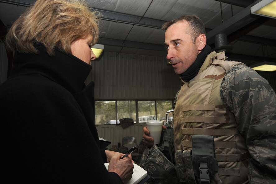 Ms. Elisabeth Bumiller, New York Times reporter, interviews Lt. Col. James Duban, from Randolph Air Force Base, Texas, about his upcoming deployment during an Air Advisor Course, hosted by the U.S. Air Force Expeditionary Center, at a range on Fort Dix, N.J., Jan. 27.  The Air Advisor Course is a combined effort between USAFEC, AETC, AFCENT and contractors to prepare Airmen deploying to Iraq and Afghanistan to train air force members in those countries.  (U.S. Air Force Photo/Staff Sgt. Nathan Bevier)