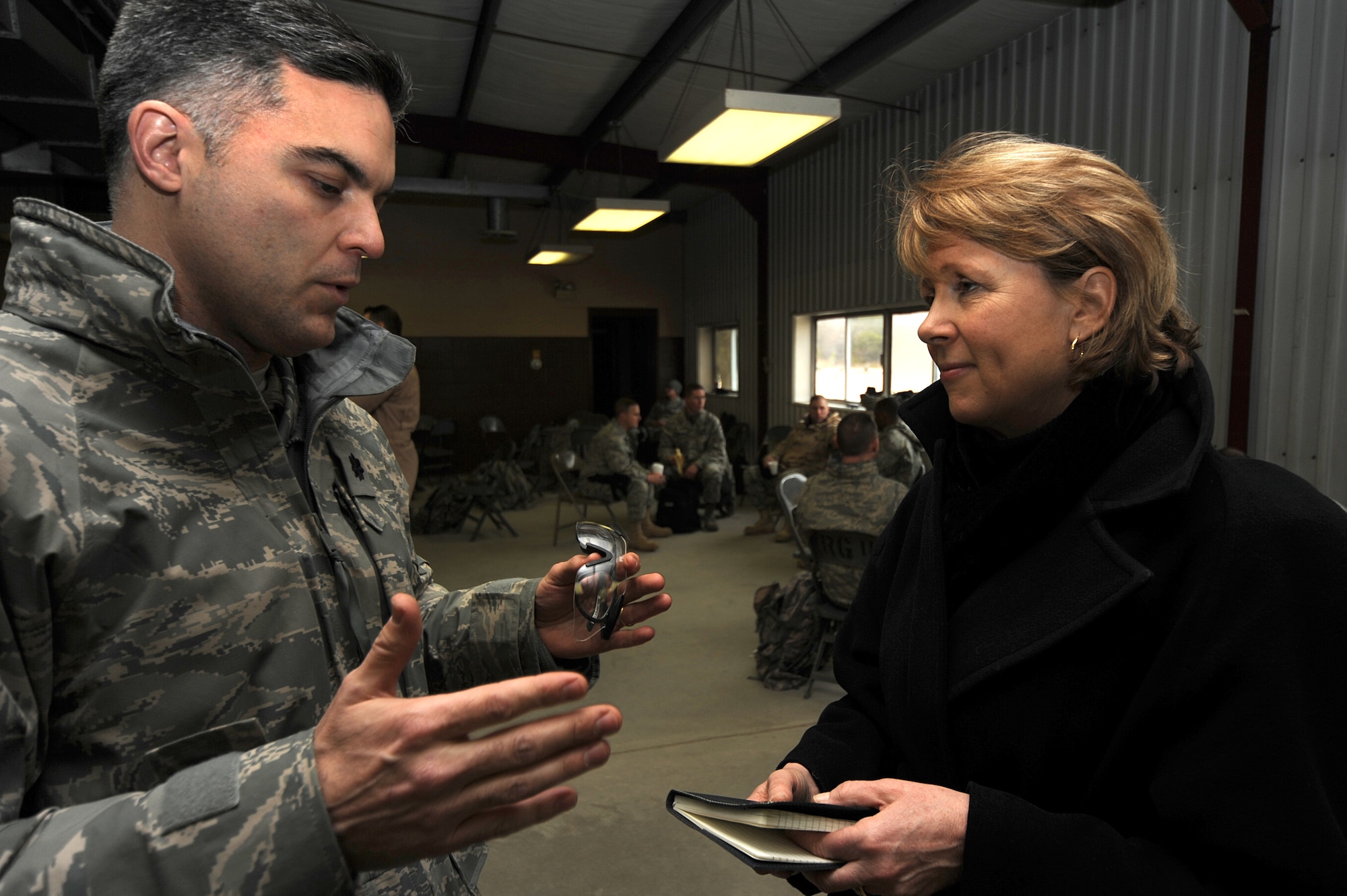 Ms. Elisabeth Bumiller, New York Times reporter, interviews a student about his upcoming deployment during an Air Advisor Course, hosted by the U.S. Air Force Expeditionary Center, at a range on Fort Dix, N.J., Jan. 27.  The Air Advisor Course is a combined effort between USAFEC, AETC, AFCENT and contractors to prepare Airmen deploying to Iraq and Afghanistan to train air force members in those countries.  (U.S. Air Force Photo/Staff Sgt. Nathan Bevier)