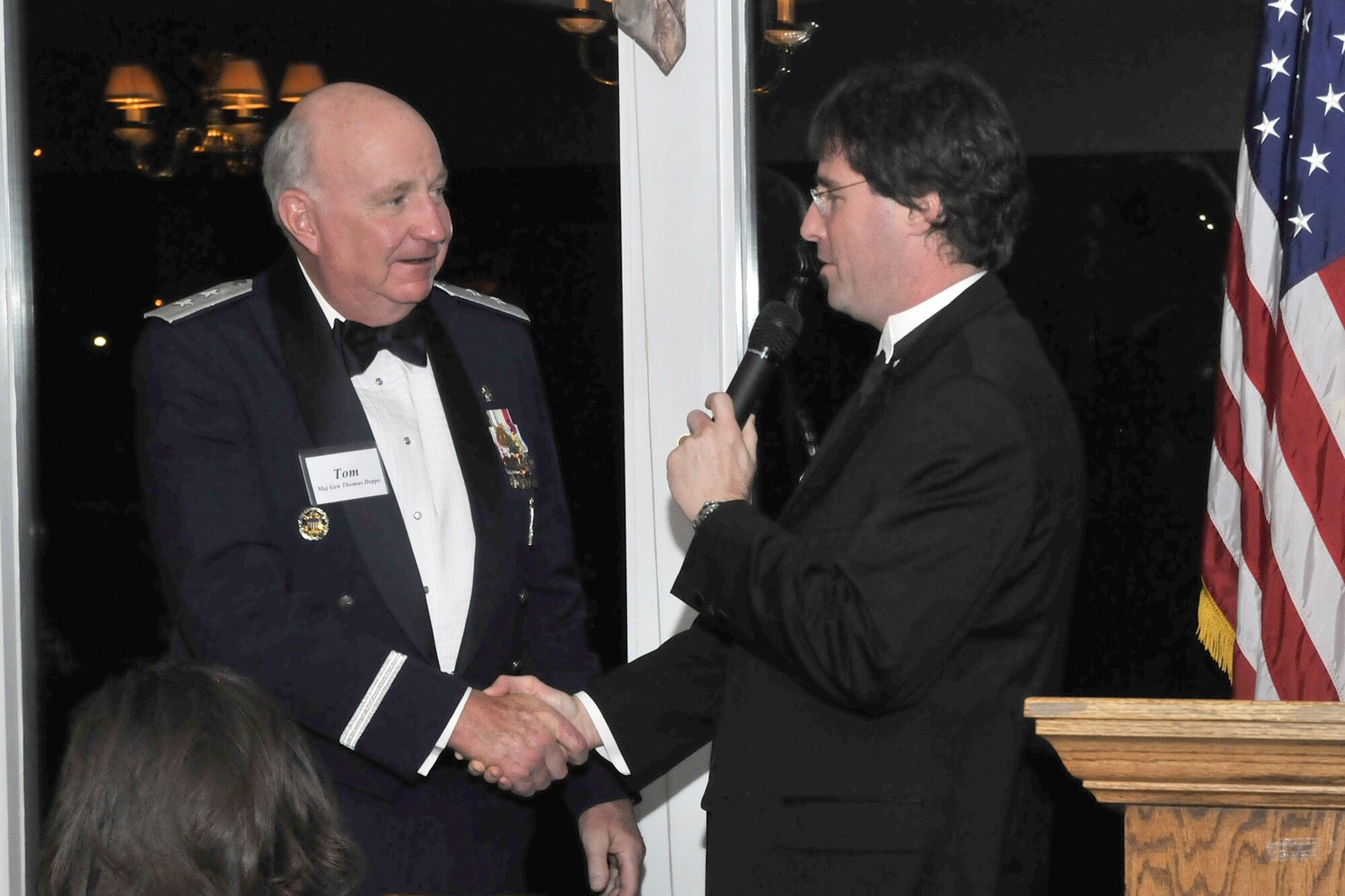 David Weismann, current president of the Military Affairs Committee, thanks Maj. Gen. Thomas Deppe, Air Force Space Command vice commander, for being the guest speaker at the annual MAC Ball. The event was held Jan. 24 at the Meadowlark Country Club in Great Falls. (U.S. Air Force photo/John Turner)