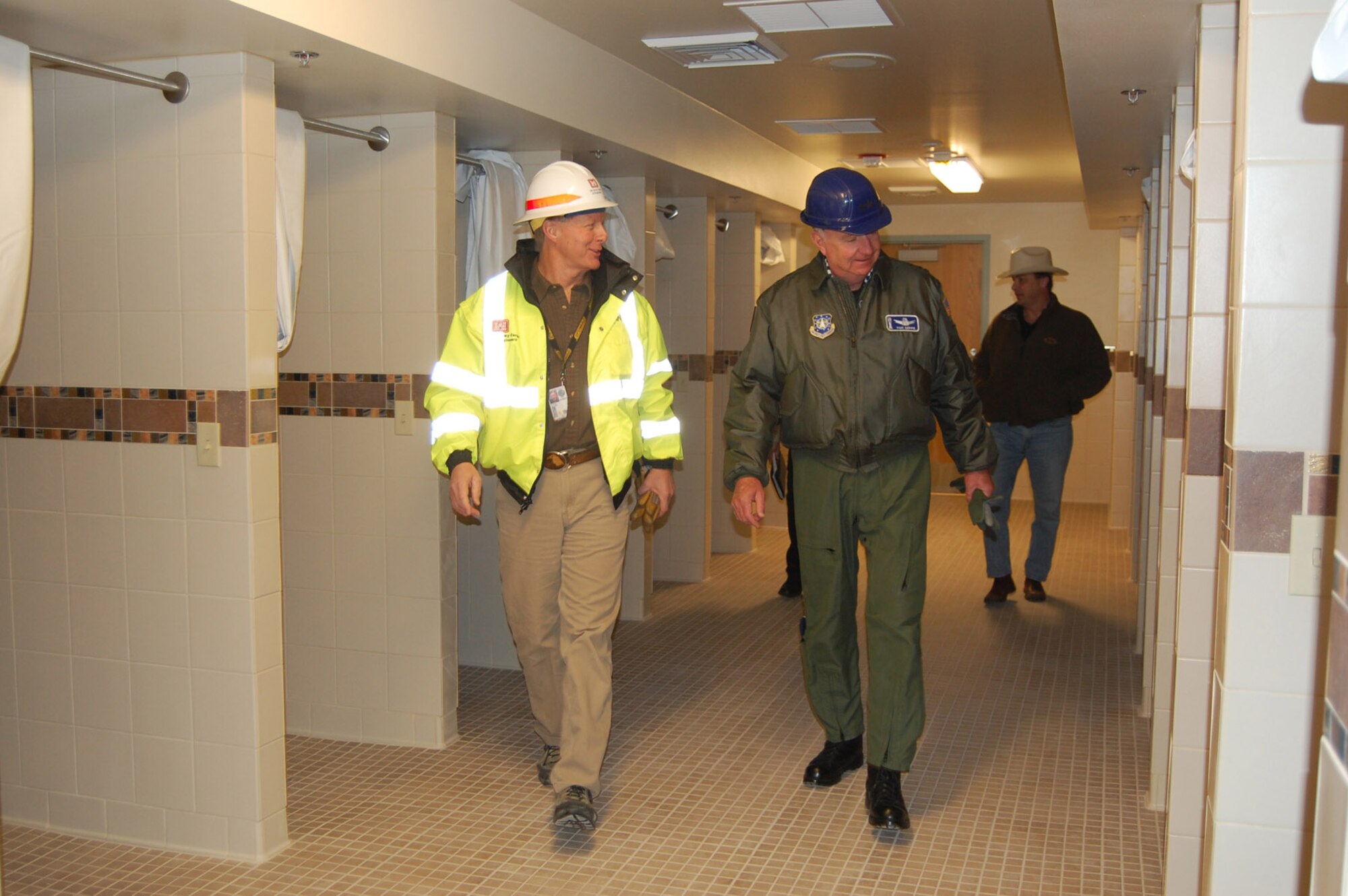 Bill McLaughlin, Chief of the 341st Civil Engineer Flight, escorts Maj. Gen. Thomas Deppe, Air Force Space Command vice commander, on a tour of the nearly completed new Fitness Center Jan. 23. General Deppe was at Malmstrom to be the guest speaker at the Military Affairs Committee's annual ball Jan. 24. (U.S. Air Force photo/Staff Sgt. Edyie Sakura)