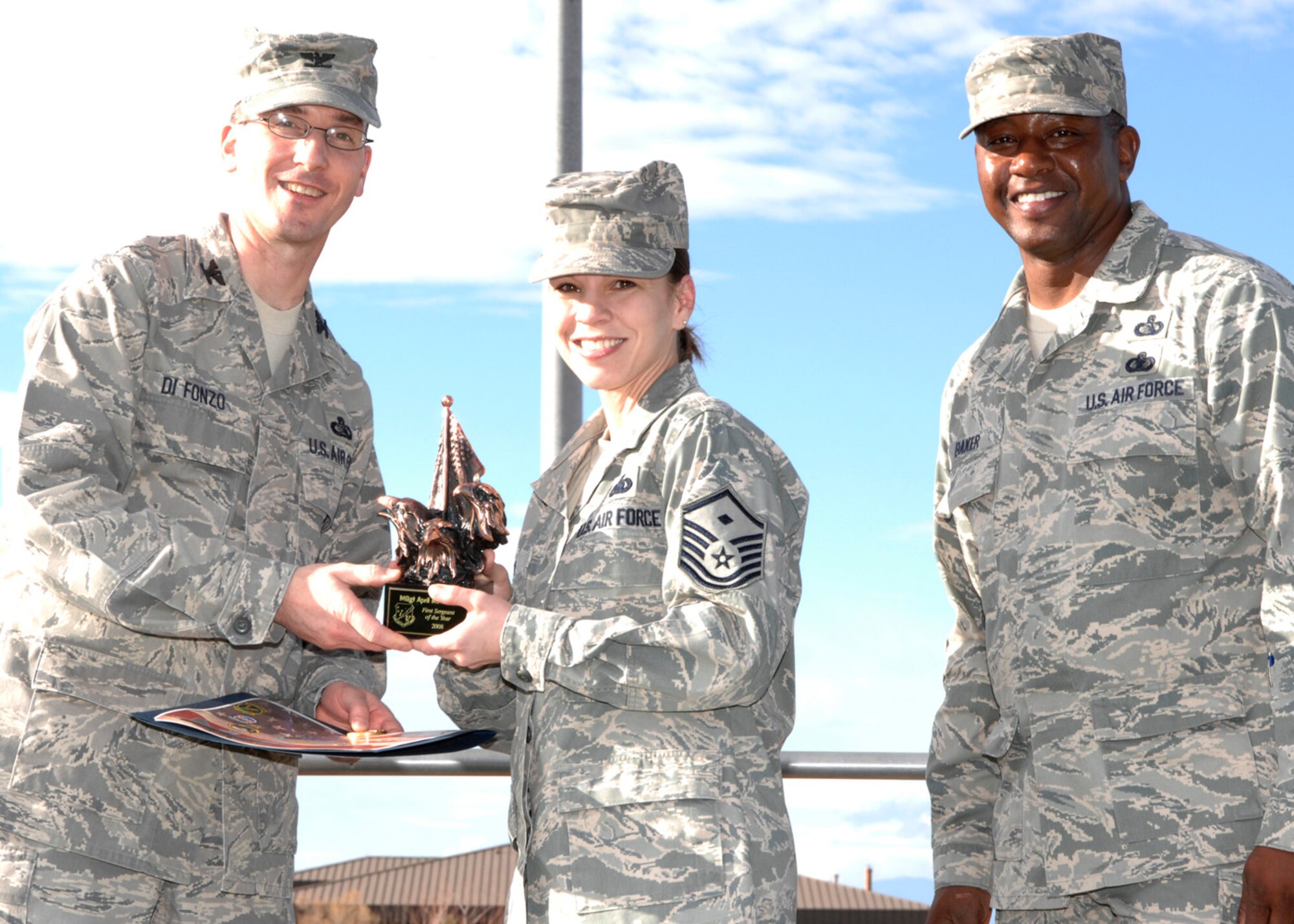 Master Sgt. April Owen, 49th Force Support Squadron first sergeant, wins in the first sergeant of the year category at the 49th Mission Support Group's annual awards formation ceremony, Jan. 23 at Holloman Air Force Base, N.M. The award is presented by Col. Stephen Difonzo, 49th MSG commander and Chief Master Sgt. Jerome Baker, 49th MSG superintendent.  (U.S. Air Force photo/Airman 1st Class Rachel A. Kocin)