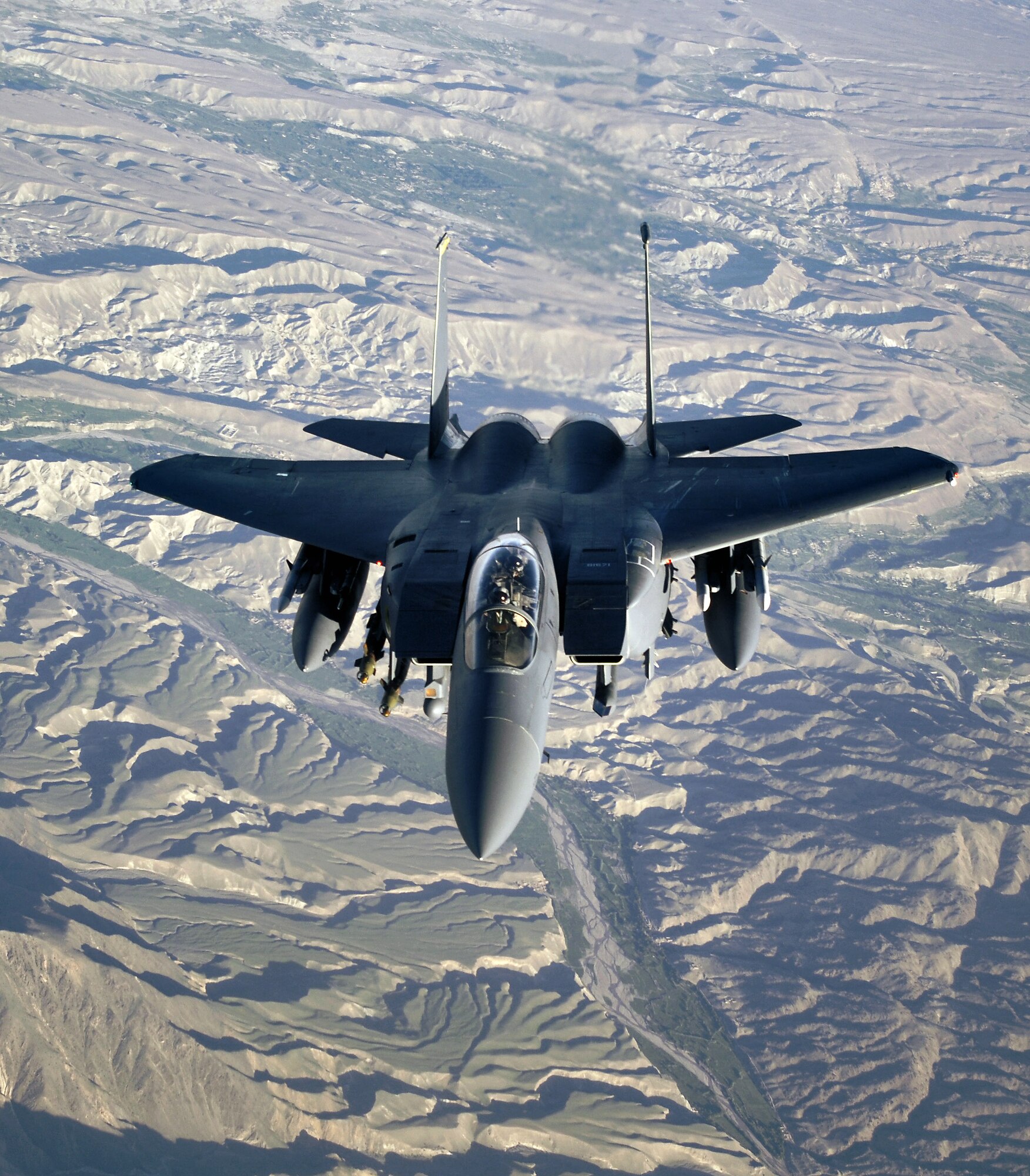 An F-15E Strike Eagle soars over the mountains and high desert of Afghanistan providing close-air support to troops on the ground engaged in rooting out insurgent sanctuaries and support networks. The Strike Eagle is a dual-role fighter designed to perform air-to-air and air-to-ground missions. (U.S. Air Force photo/Master Sgt. Lance Cheung)

