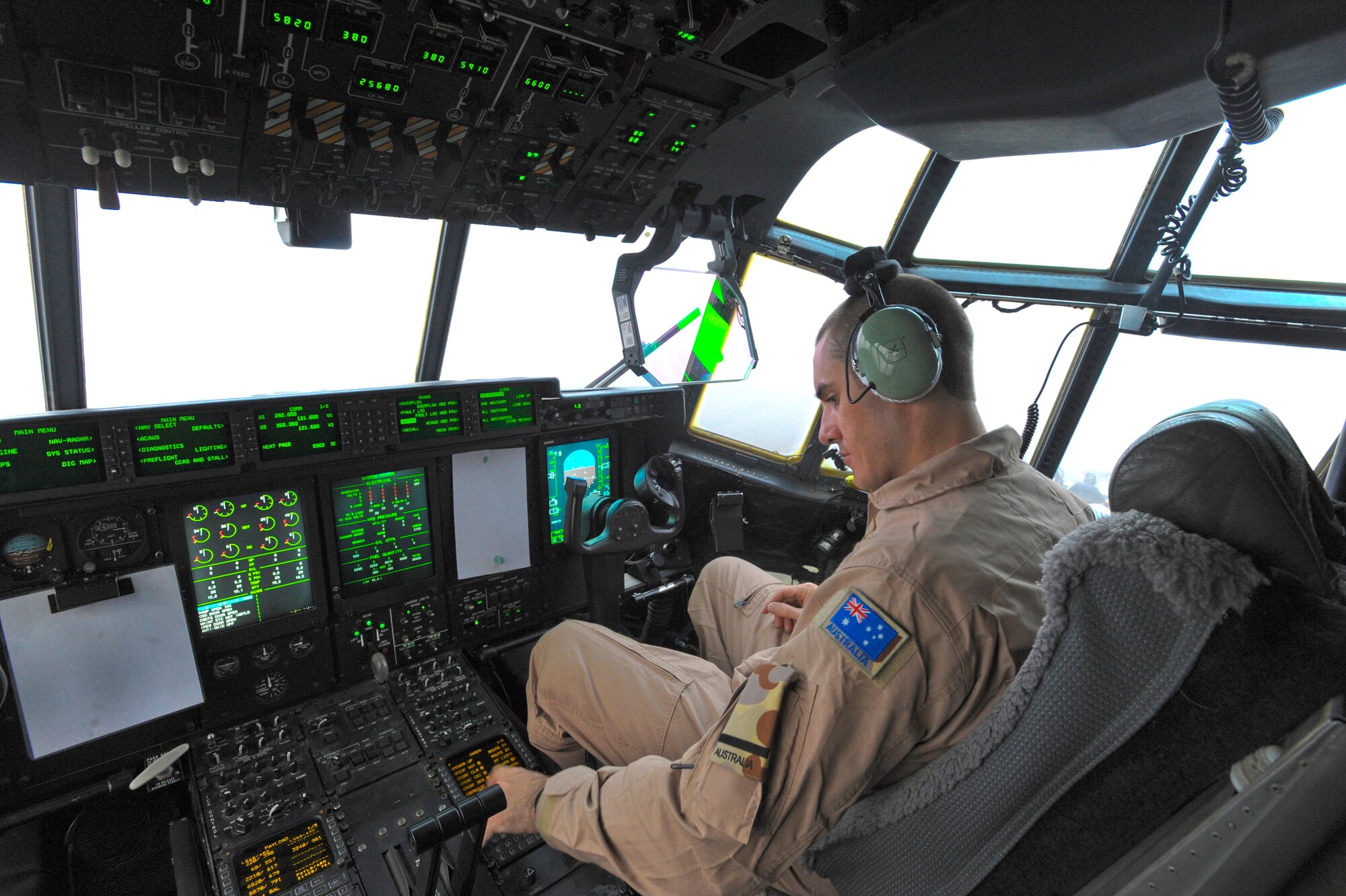 Flying Officer Adam Bendeich, of the Royal Australian Air Force, runs through the pre-flight checks of a C-130J Hercules, Jan. 29, 2009, in an undisclosed location in Southwest Asia.  Prior to take off pre-flight checks are done to ensure everything on the aircraft is fully operational for the mission. Flying Officer Bendeich and fellow Australians are deployed in support of Operations Iraqi and Enduring Freedom and Combined Joint Task Force - Horn of Africa.  (U.S. Air Force Photo by Staff Sgt. Joshua Garcia/released)