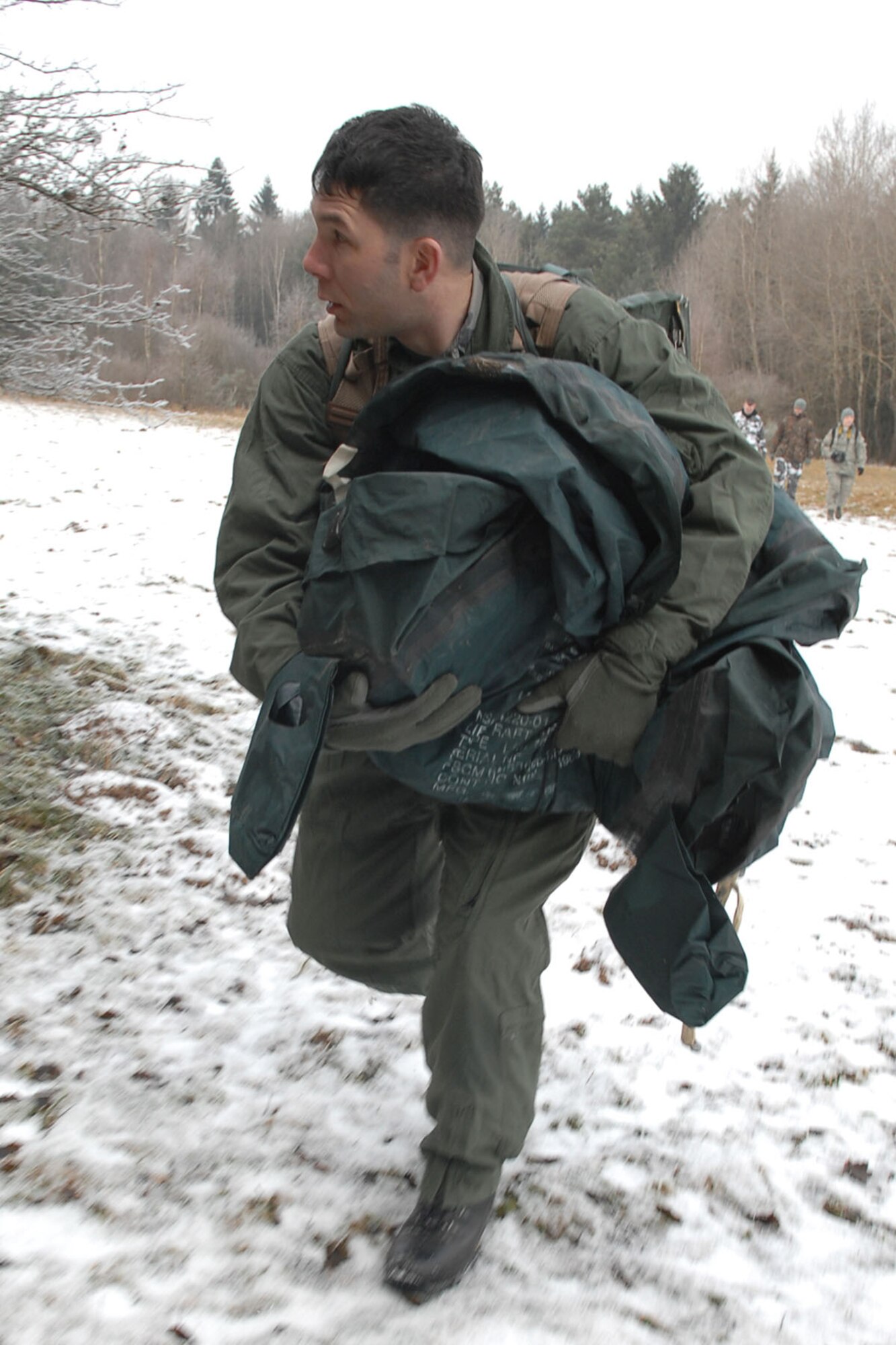 SPANGDAHLEM AIR BASE, Germany – Staff Sgt. Robert A. Martin, 52nd Operations Support Squadron, runs from enemy forces during a Survival Evasion Resistance and Escape training exercise Jan. 27. The purpose of the course was to offer training to evade and escape enemy forces. (U.S. Air Force photo by Airman 1st Class Nicholas Wilson)