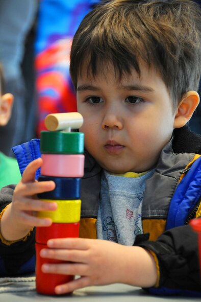 MISAWA CITY, Japan -- Tyler Bristow, son of Master Sgt. Jerome Bristow, 35th Maintenance Squadron, plays with pieces of a daruma doll during a Shougatsu celebration Jan. 25, 2009, at the Misawa International Center. In the Japanese culture, daruma dolls are symbolic for optimism, persistence and strong determination. (U.S. Air Force photo by Senior Airman Jamal D. Sutter) 