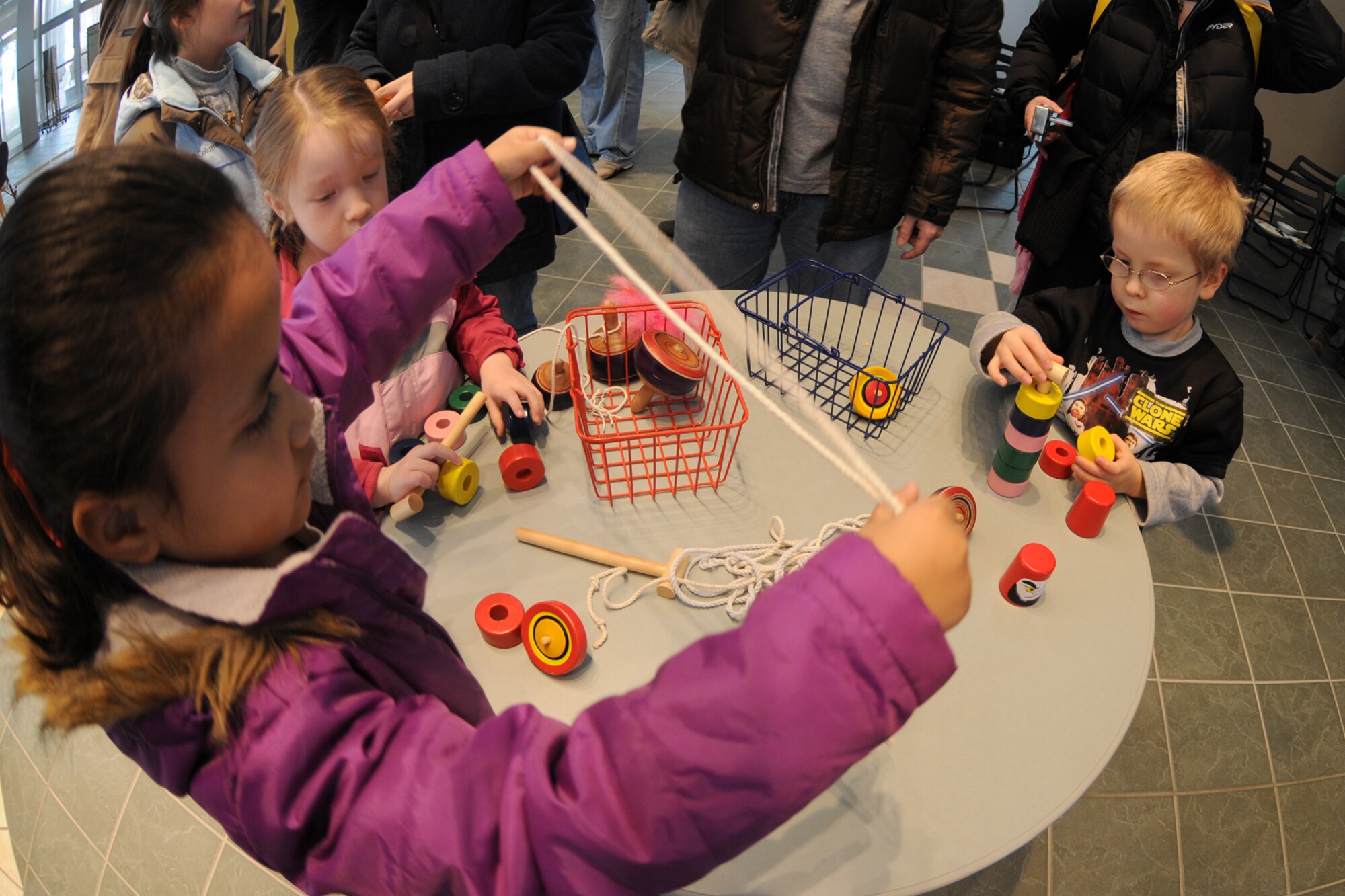 MISAWA CITY, Japan -- Meaalofa Crawford and Alexander Park play with Japanese toys during a Shougatsu celebration Jan. 25, 2009, at the Misawa International Center. Family members of all ages came out in support of the event and helped bring in the new year. (U.S. Air Force photo by Senior Airman Jamal D. Sutter)