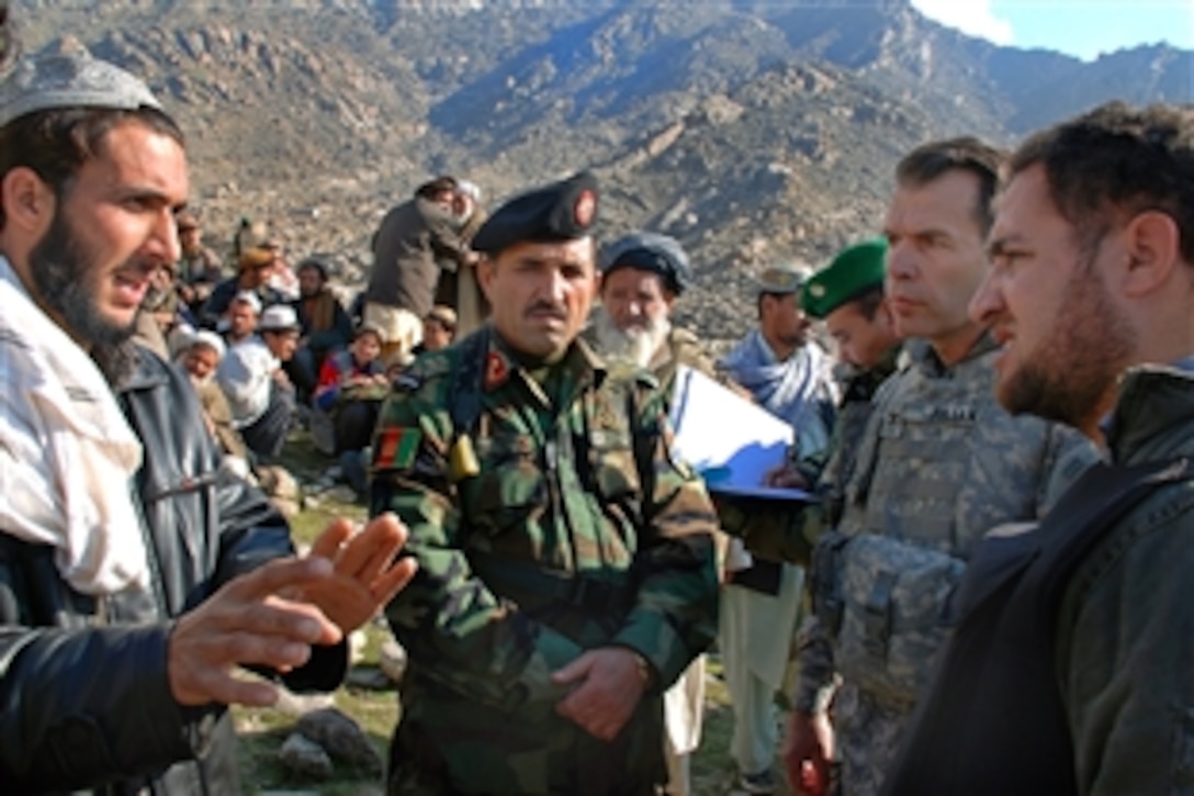 U.S. Army Col. Greg Julian, public affairs officer for the United States Forces, Afghanistan, leads an investigation team to meet with villagers in Tagab, Afghanistan, Jan. 27, 2009. The team worked with the Afghan ministeries of defense and information to explore allegations of possible civilian casualties after a recent mission to capture Taliban leaders.