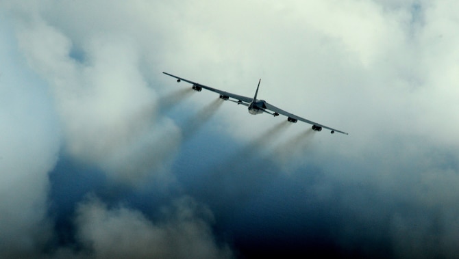 ANDERSEN AIR FORCE BASE, Guam -- A B-52 Stratofortress from Minot AFB, N.D. flies over the Pacific Ocean Jan. 29 during exercise Tropic Fury during a live drop mission. The B-52 dropped 250 lb. M-117 ordnance. The exercise was developed to train aircrew on the use of conventional air launched crew missiles and joint air-to-surface standoff missile conventional weapon systems. The B-52 is deployed to Andersen AFB, Guam, with the 23rd Expeditionary Bomb Squadron and is part of a continous bomber presence in the region. The bomber rotation to Andersen is aimed at enhancing regional security and demonstrating U.S. commitment to the Pacific region. The Air Force will continue to rotate bombers and fighters on a regular basis to ensure regional stability. (U.S. Air Force photo by Master Sgt. Kevin J. Gruenwald) 